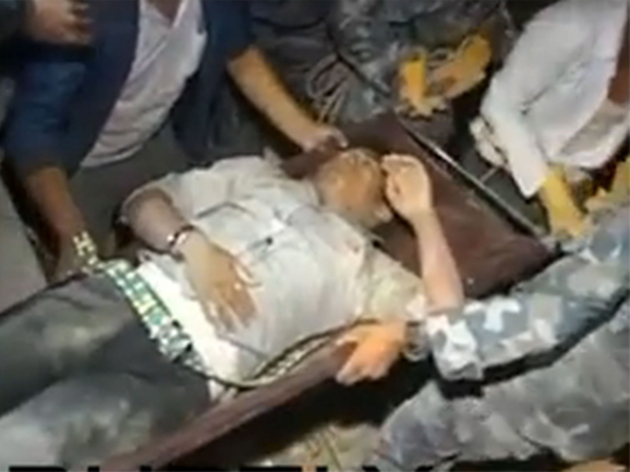 Man being pulled from the rubble in the Kathmandu Valley