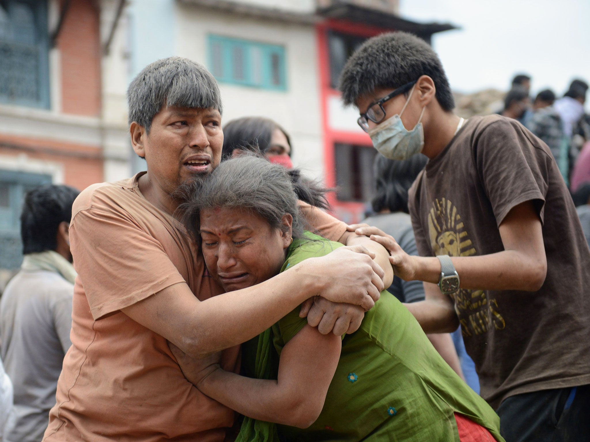 A Nepalese man and woman hold each other in Kathmandu's Durbar Square