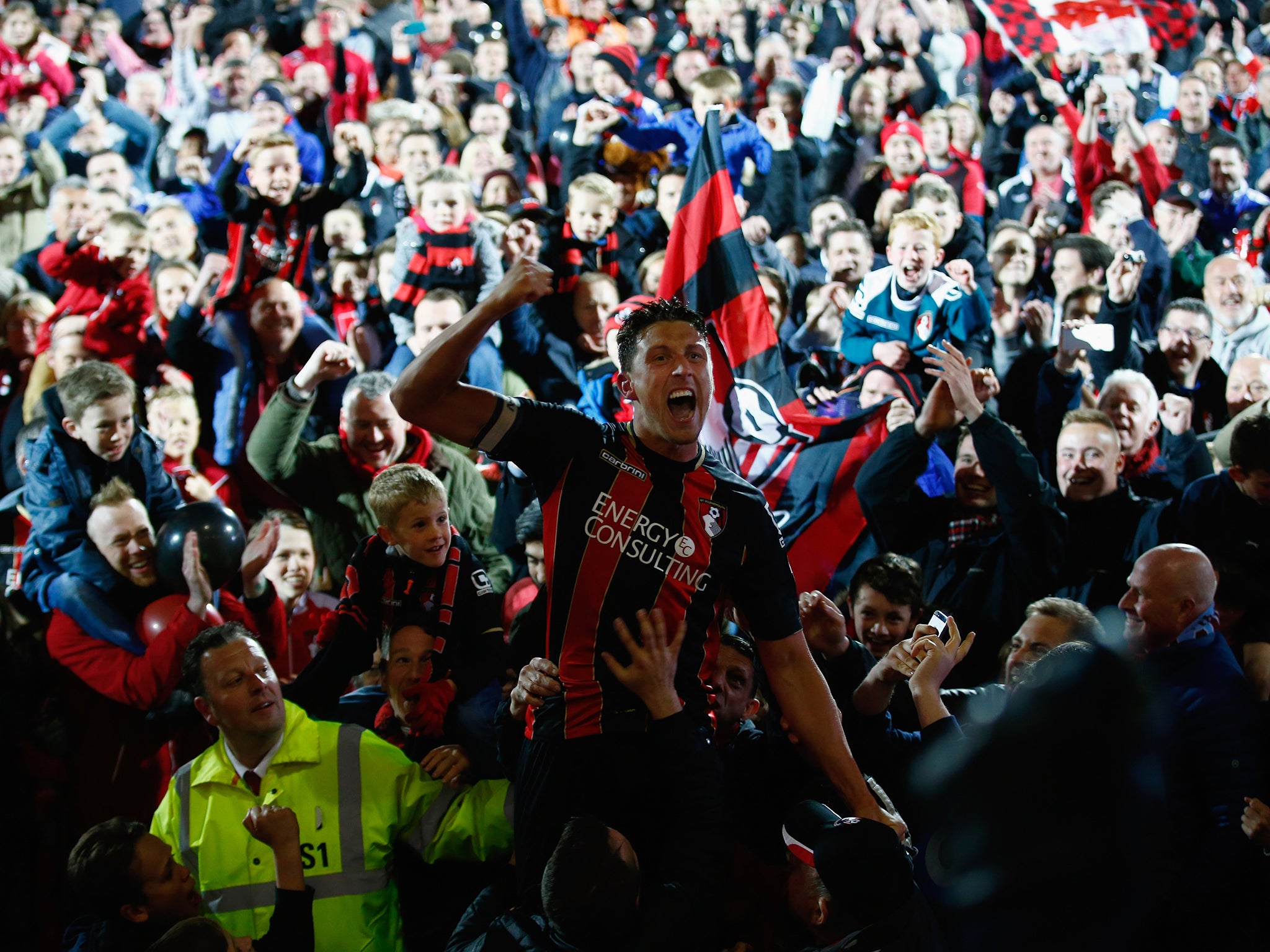 Captain Tommy Elphick of Bournemouth celebrates promotion