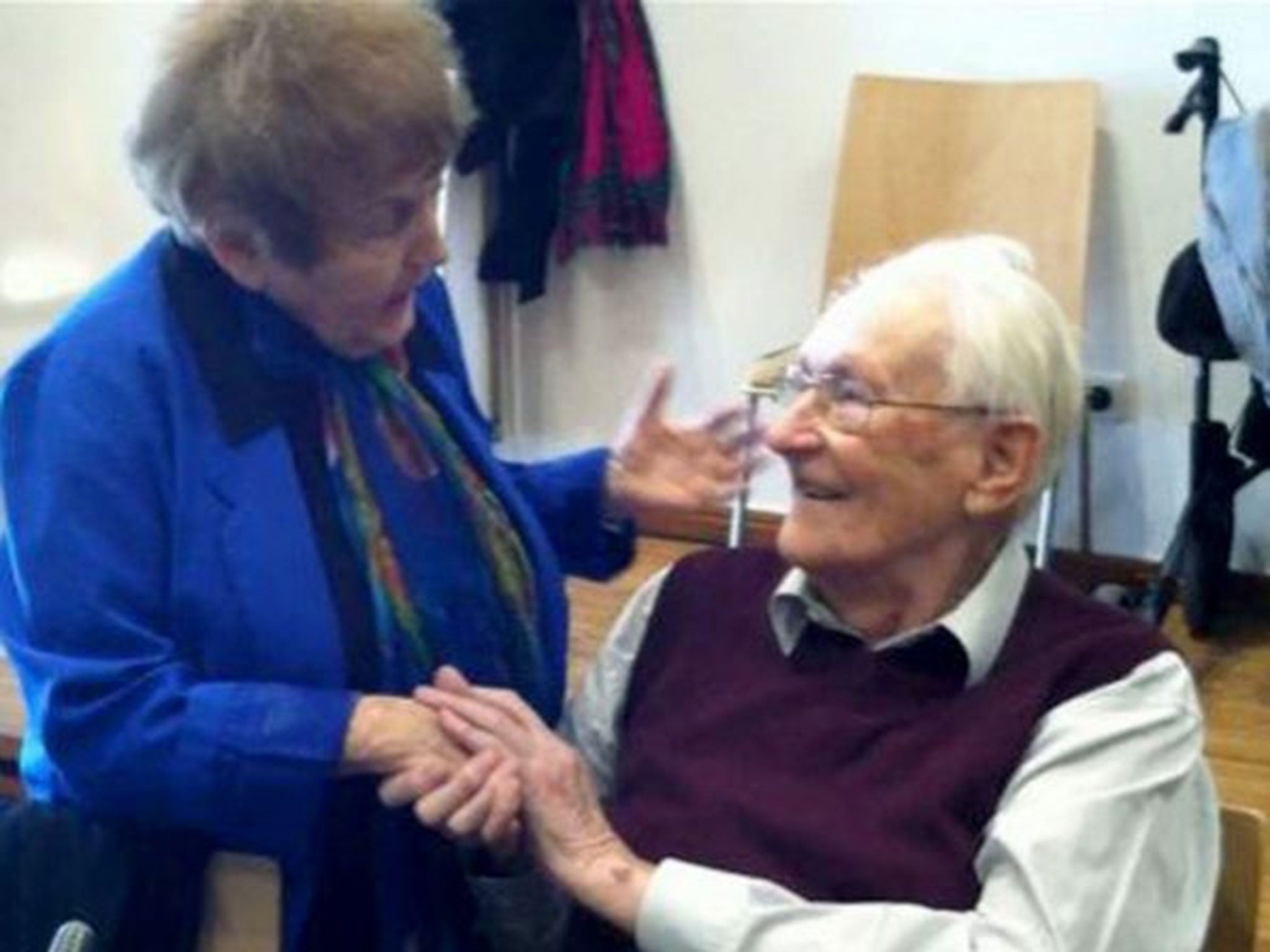 Auschwitz survivor Eva Kor during a conciliatory handshake with former SS member Oskar Groening