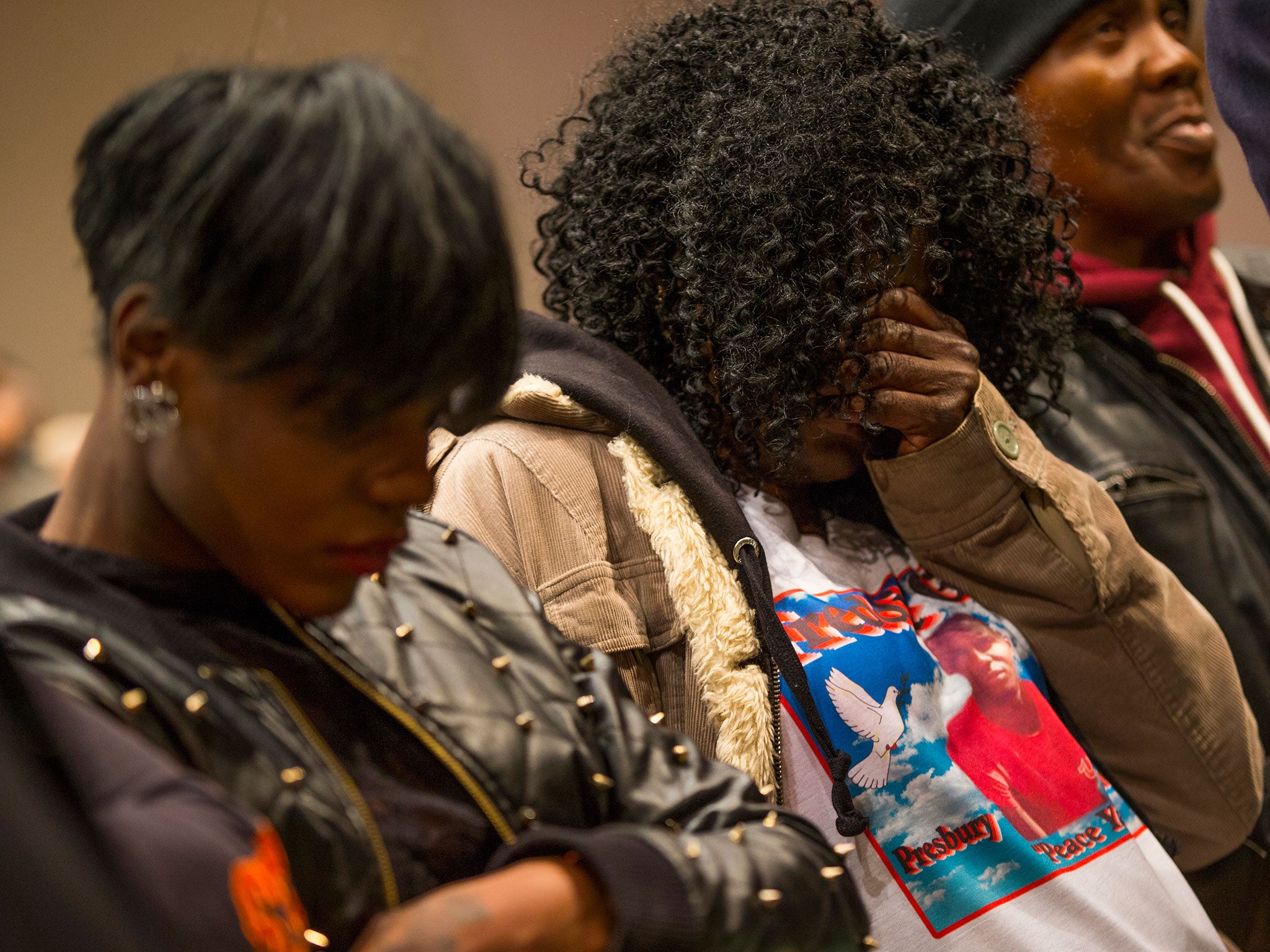 Gloria Darden, mother of Freddie Gray, covers her face during a news conference after a day of unrest following the funeral of Gray