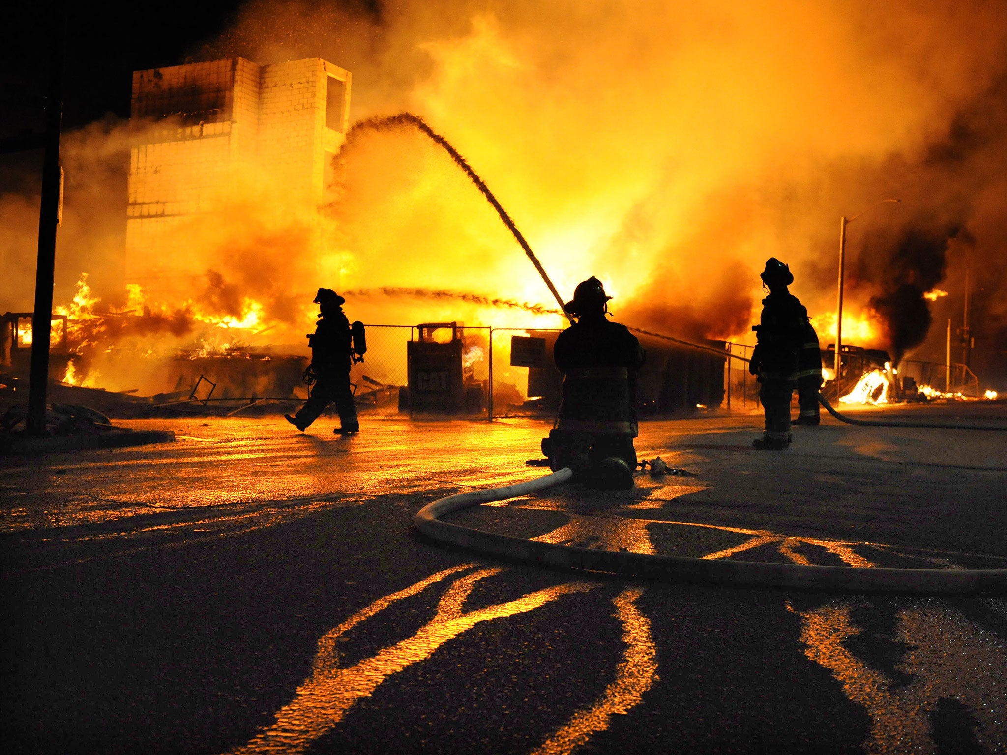 Baltimore firefighters battle a three-alarm fire at a senior living facility under construction at Federal and Chester Streets