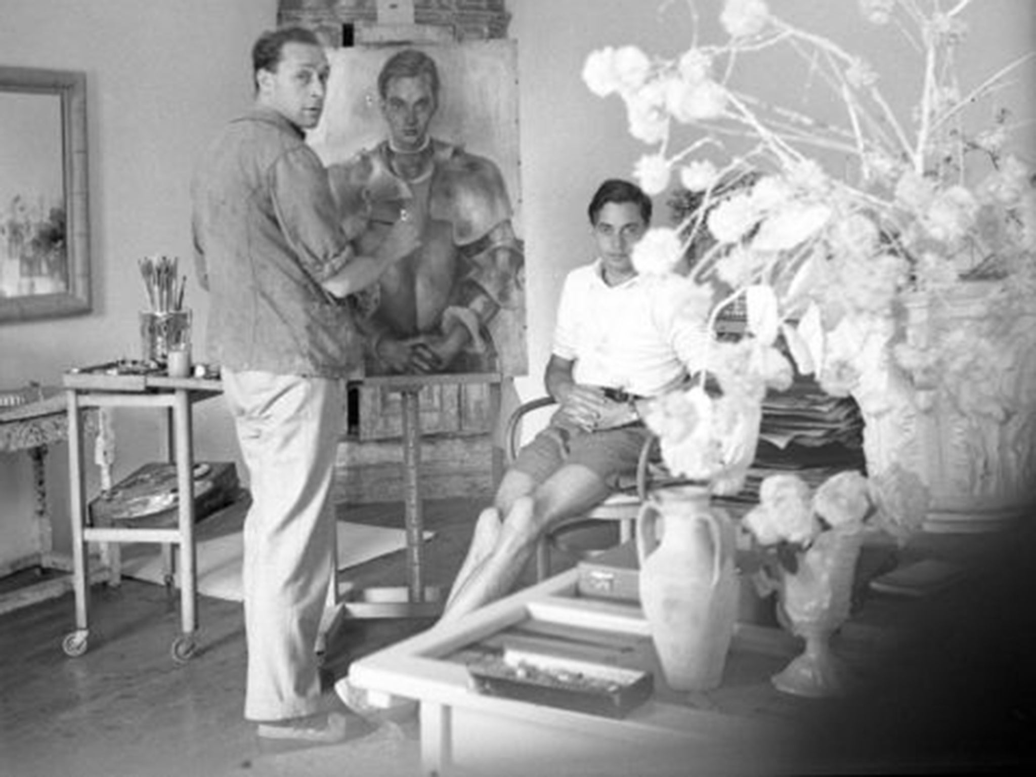 Strike a pose: Peter Watson sits while the Russian artist Pavel Tchelitchew paints him (©The Cecil Beaton Studio Archive at Sotheby's)