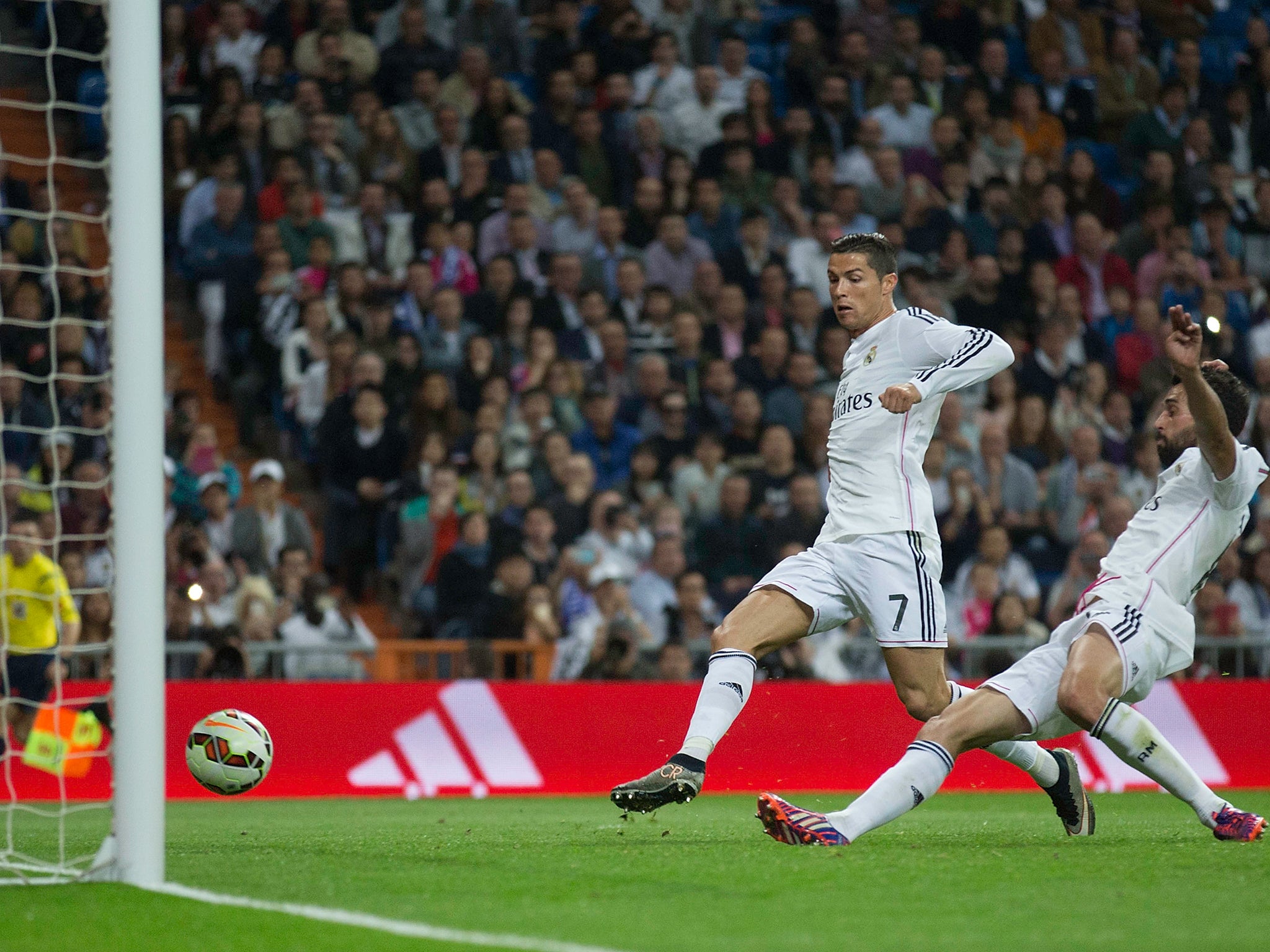 Cristiano Ronaldo is beaten to the ball by Alvaro Arbeloa