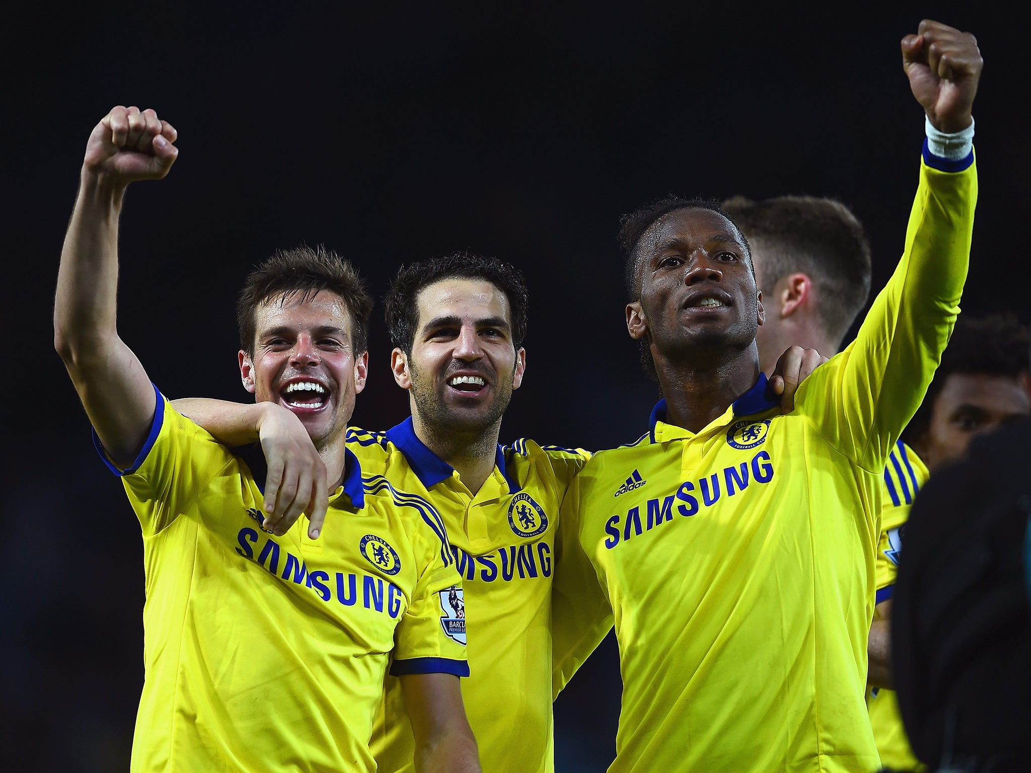 Didier Drogba, Cesc Fabregas and Cesar Azpilicueta celebrate victory over Leicester