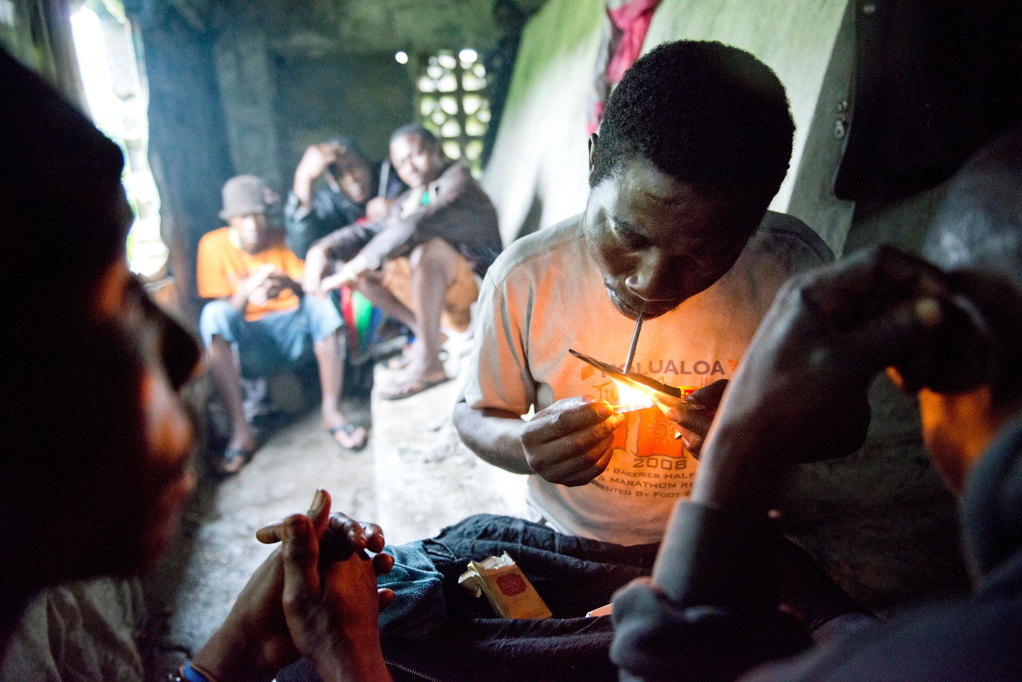 One of the cemetery's residents smokes drugs inside a tomb