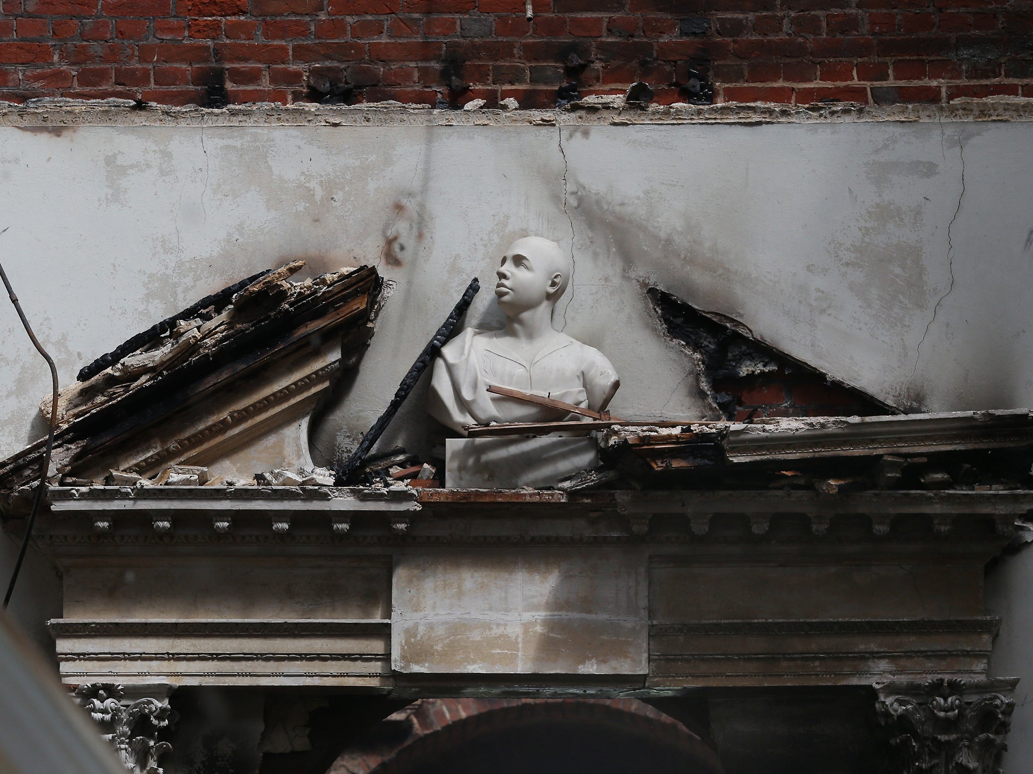 A fire-damaged entrance in its Marble Hall