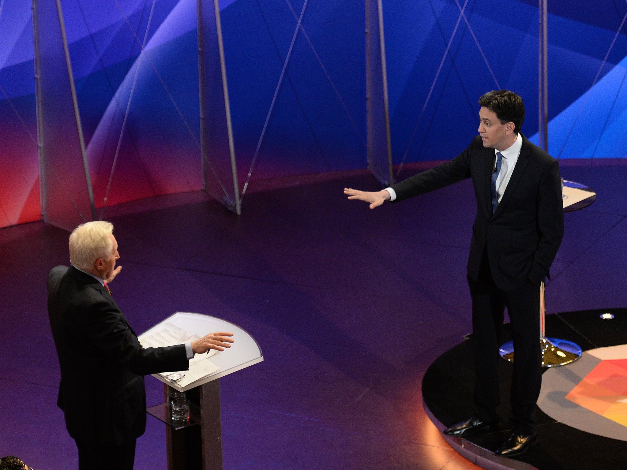 Dimbleby faces off with Ed Miliband during the final TV debate (Getty)