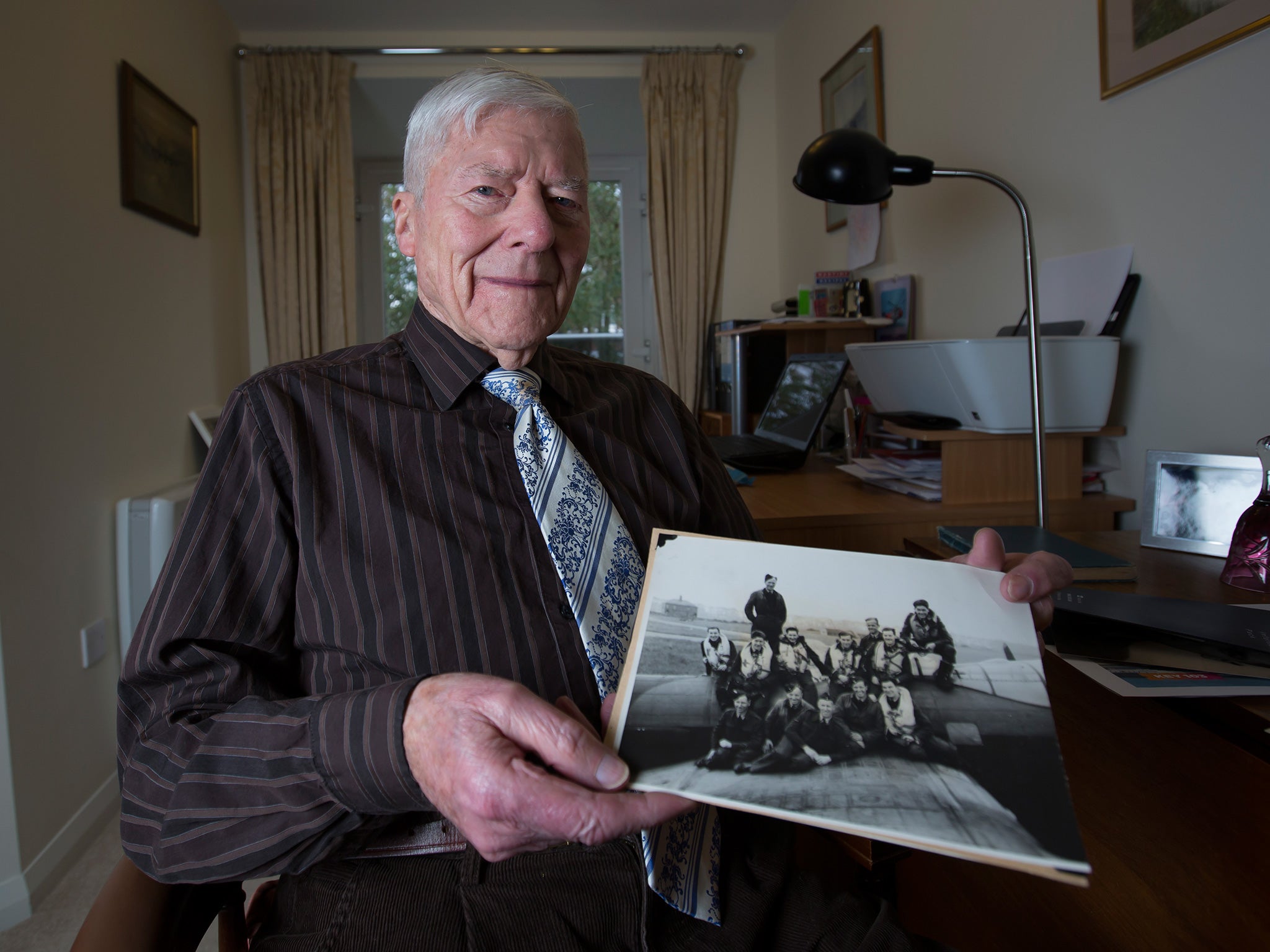 Frank Tolley, 93 – here at home in Sale, Greater Manchester – was part of a Lancaster crew taking food to starving civilians