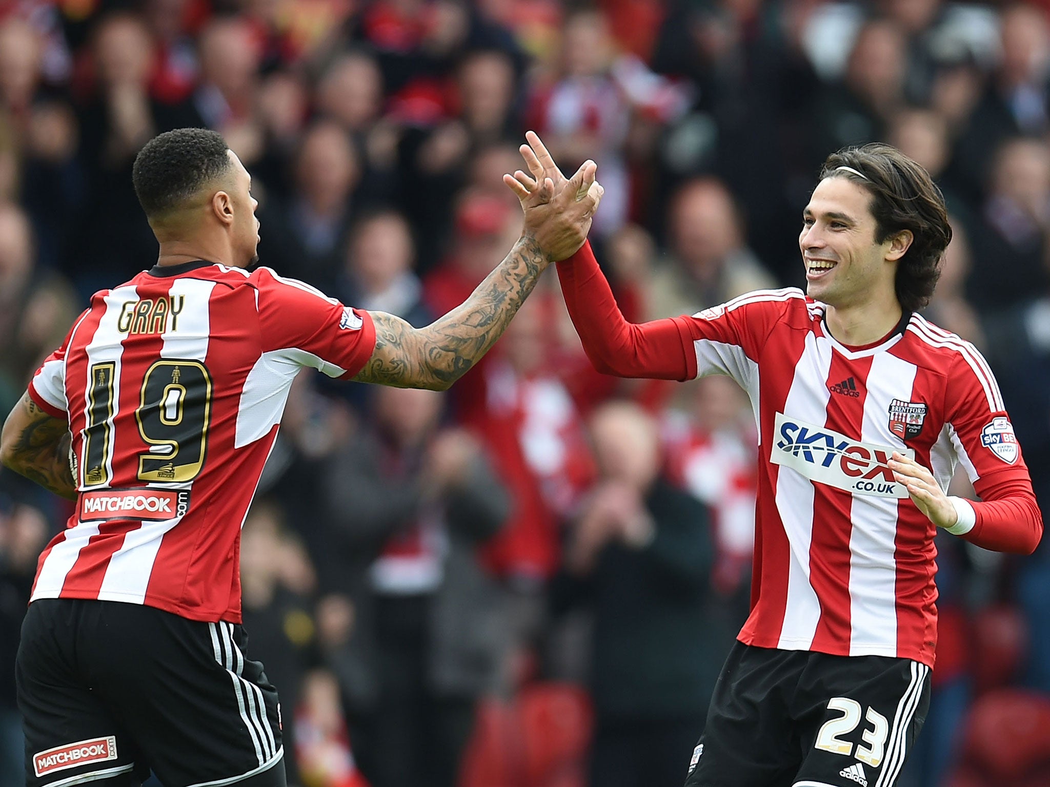 Jota (right) celebrates his goal with Andre Gray