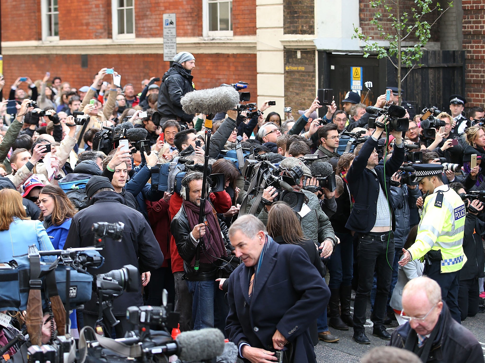 Well-wishers and media gather following the announcement that Catherine, Duchess Of Cambridge has given birth to a baby girl