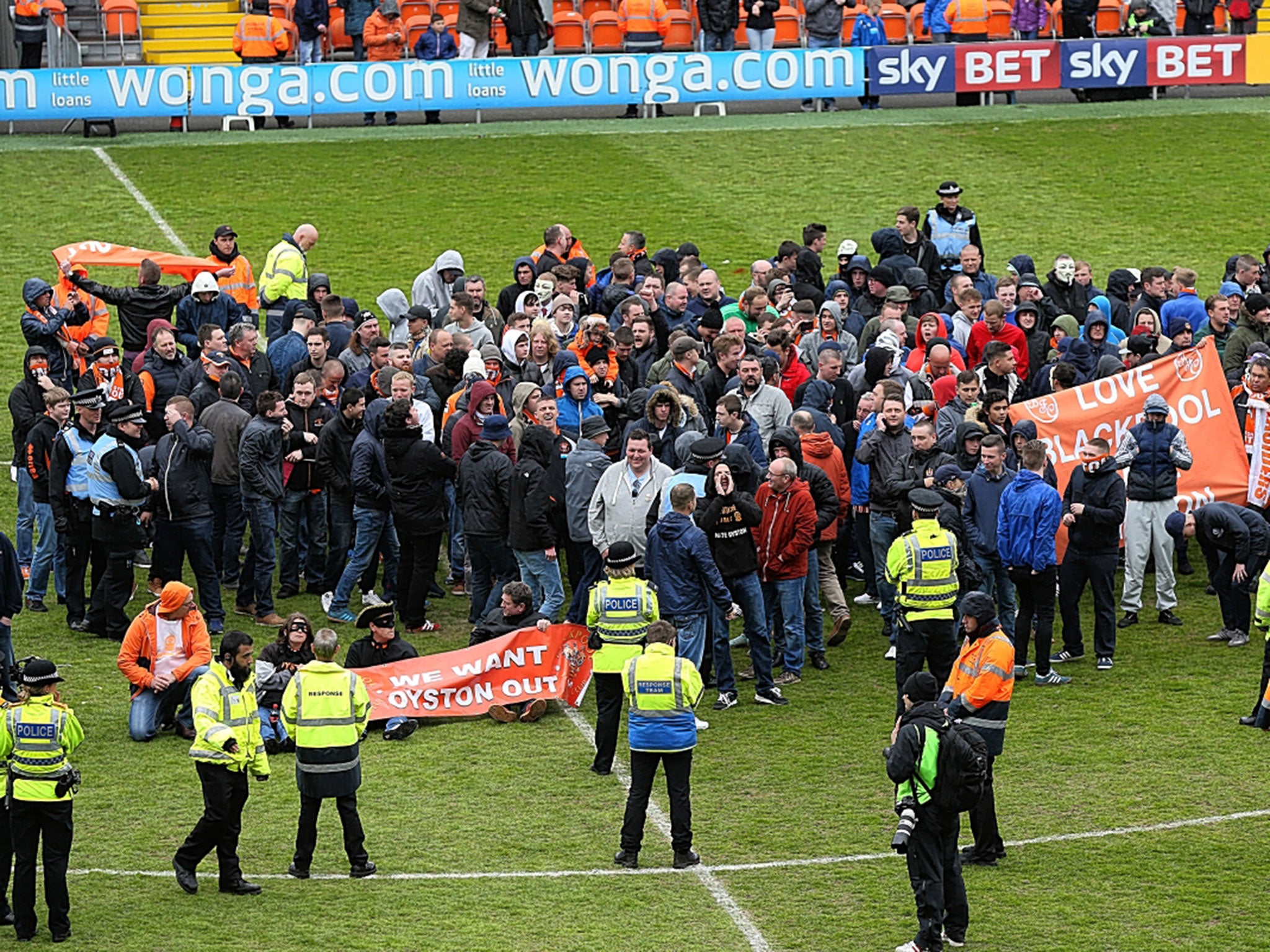 Blackpool supporters protest in the centre circle which forced the game against Huddersfield to be abandoned