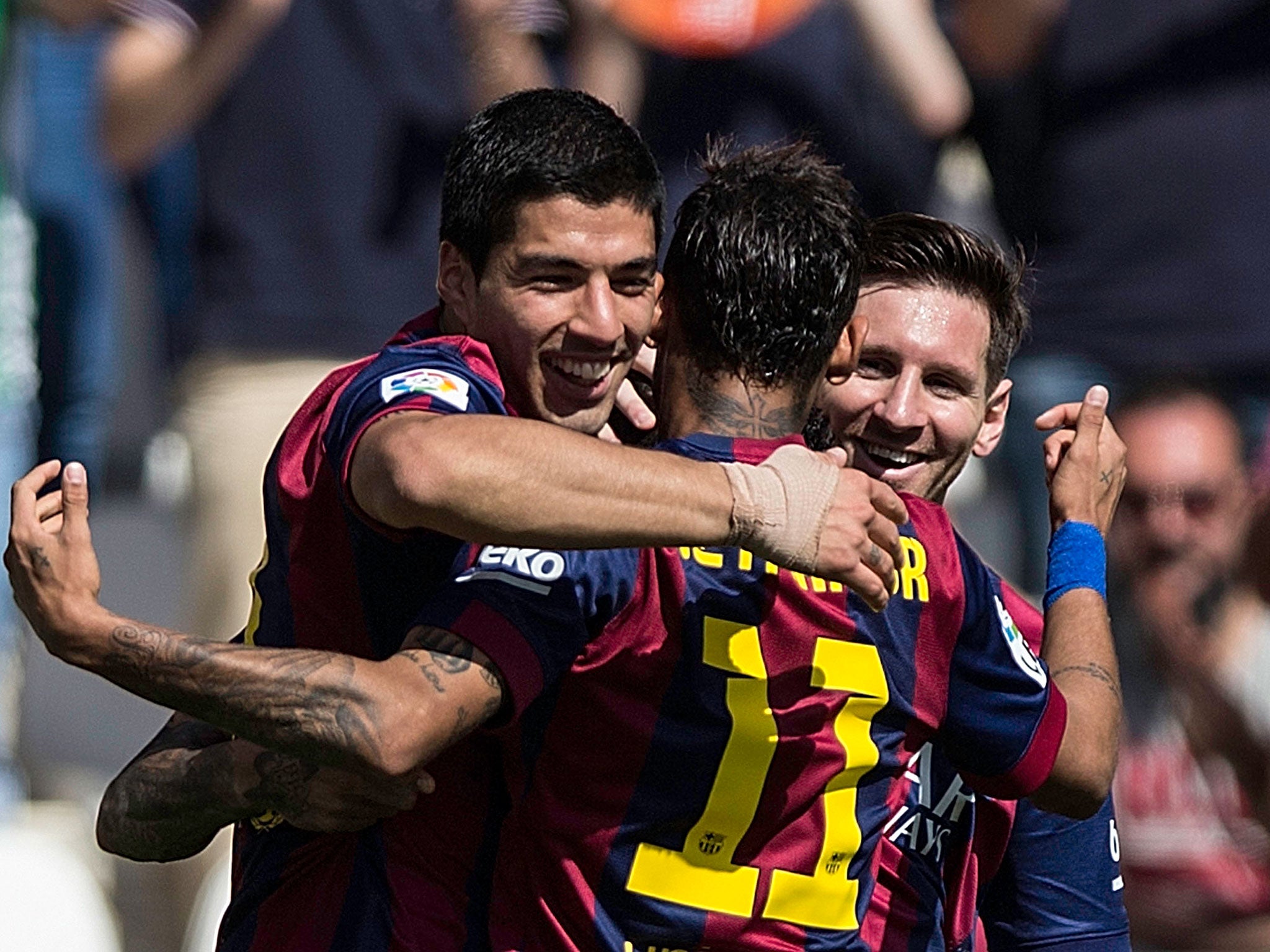 Luis Suarez celebrates his first hat-trick for Barcelona with Neymar and Lionel Messi