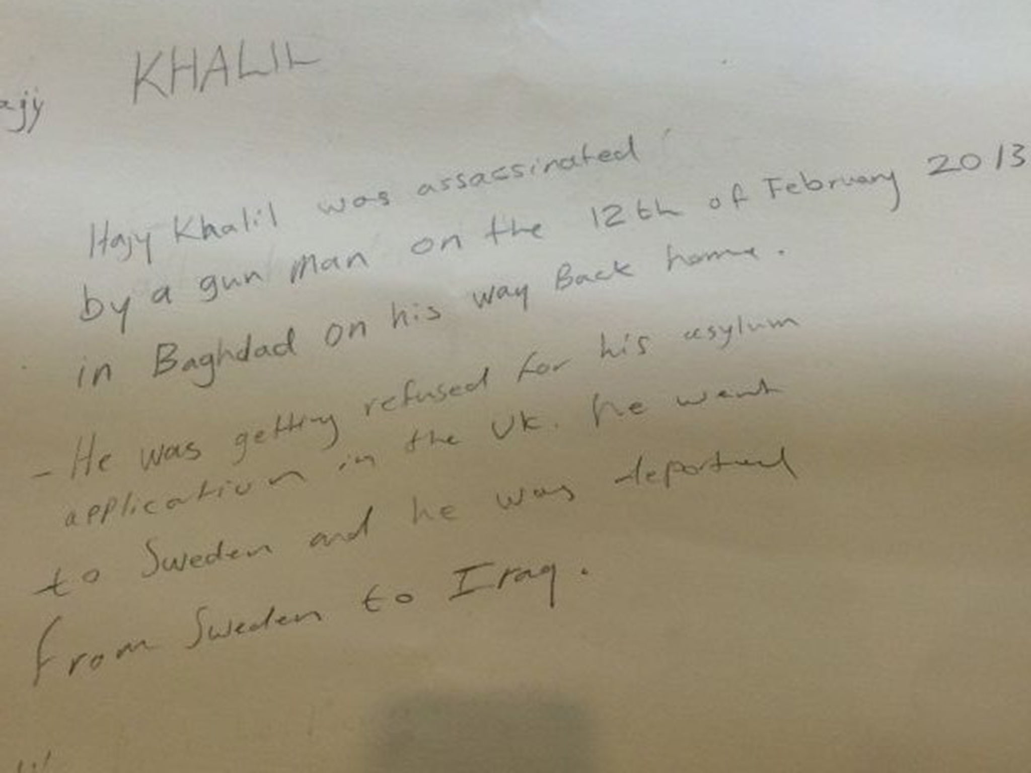 The inscription on the back of the picture revealing Mr Khalil had been shot dead in Iraq