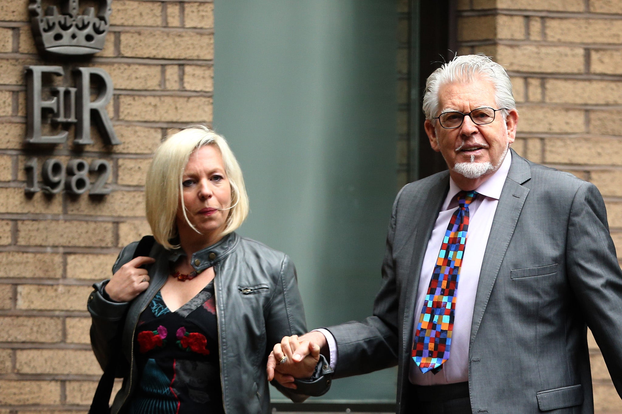 Bindi Nicholls with her father Rolf Harris outside Southwark Crown Court, where Harris was sentenced to 12 counts of indecent abuse