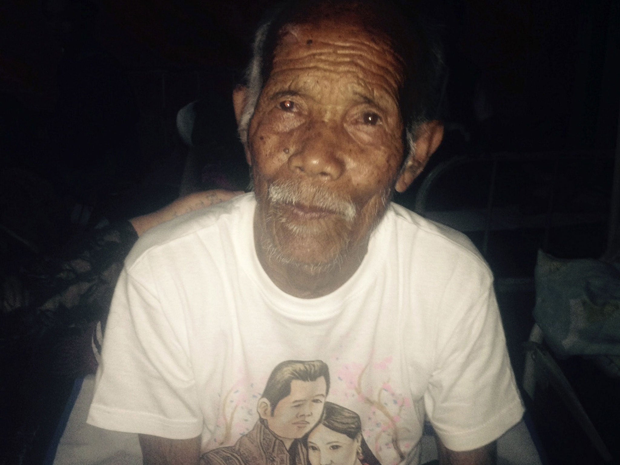 Funchu Tamang, 101, sits on a bed in a hospital in Nuwakot district on May 3, 2015, after being rescued from his collapsed home a day earlier