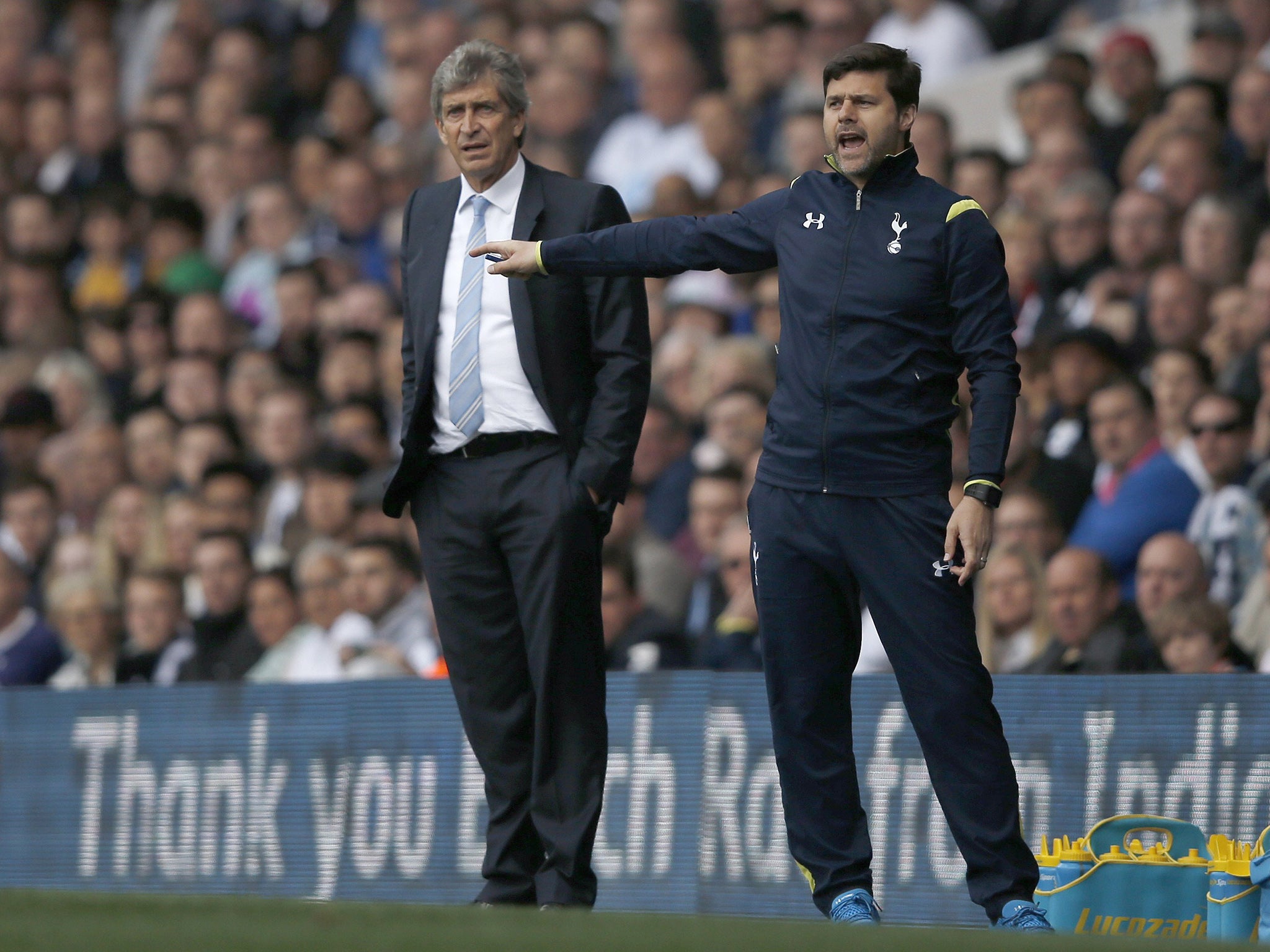 Mauricio Pochettino and Manuel Pellegrini watch the action at White Hart Lane