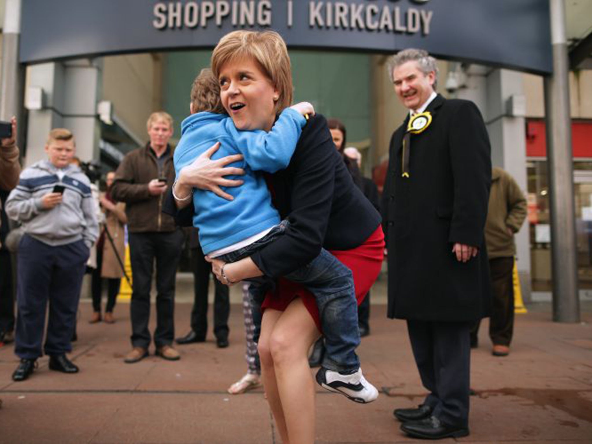 Nicola Sturgeon gets a hug from a small boy while campaigning in Kirkcaldy, former prime minister Gordon Brown’s old constituency