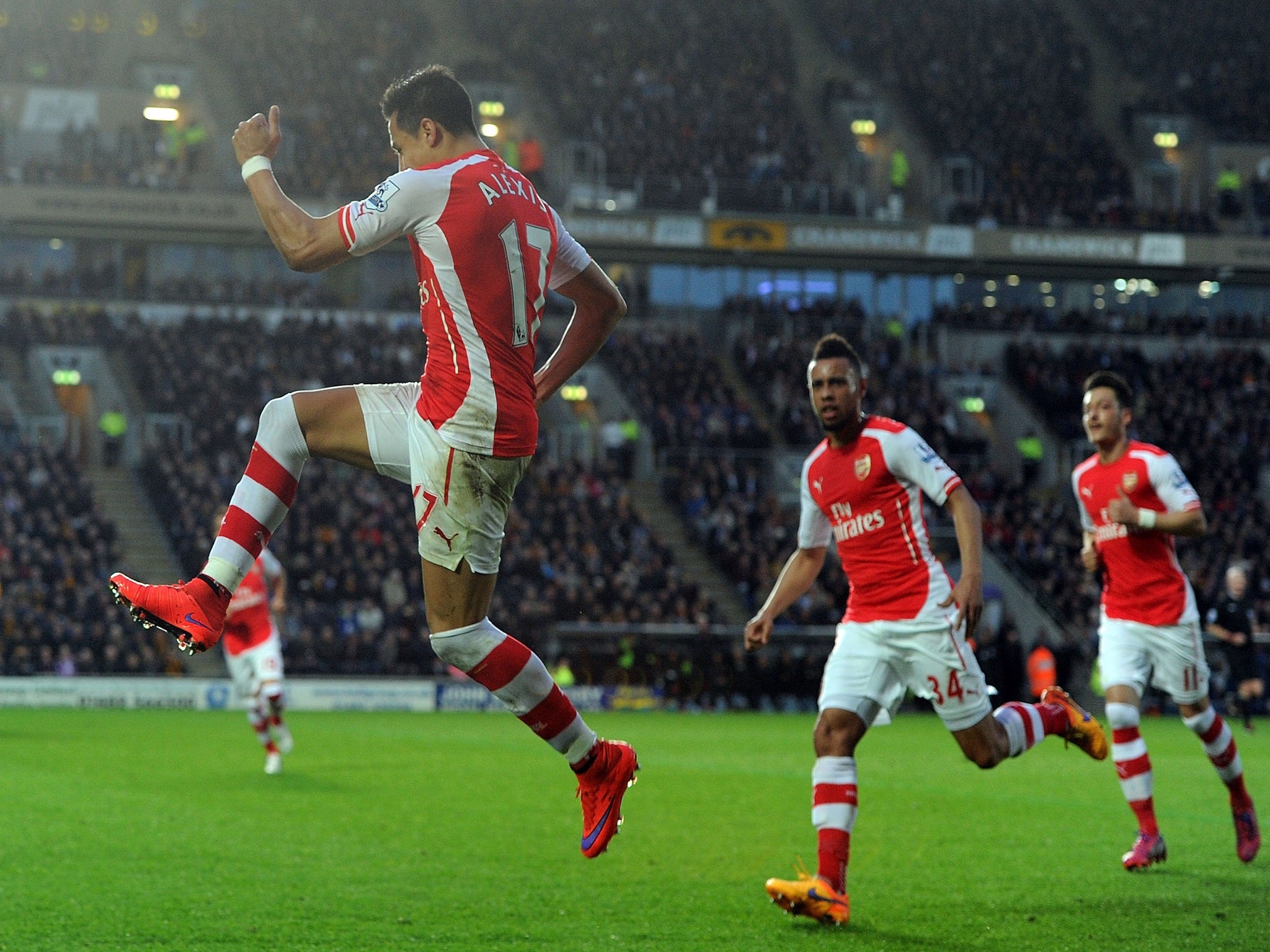 Alexis Sanchez celebrates his opener at the KC Stadium