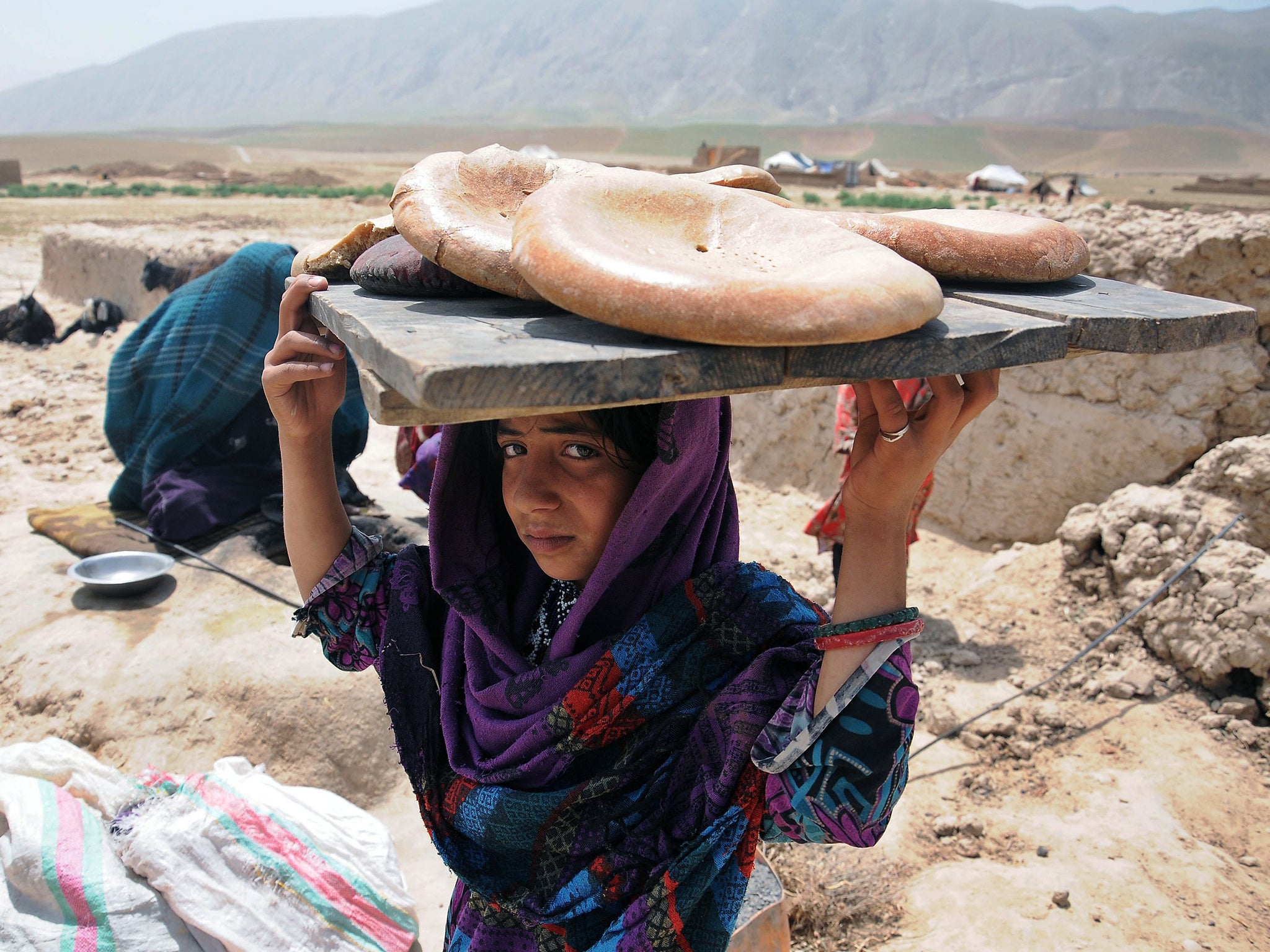 A young Afghan displaced from their home in the Sherin Tagab district of Faryab province