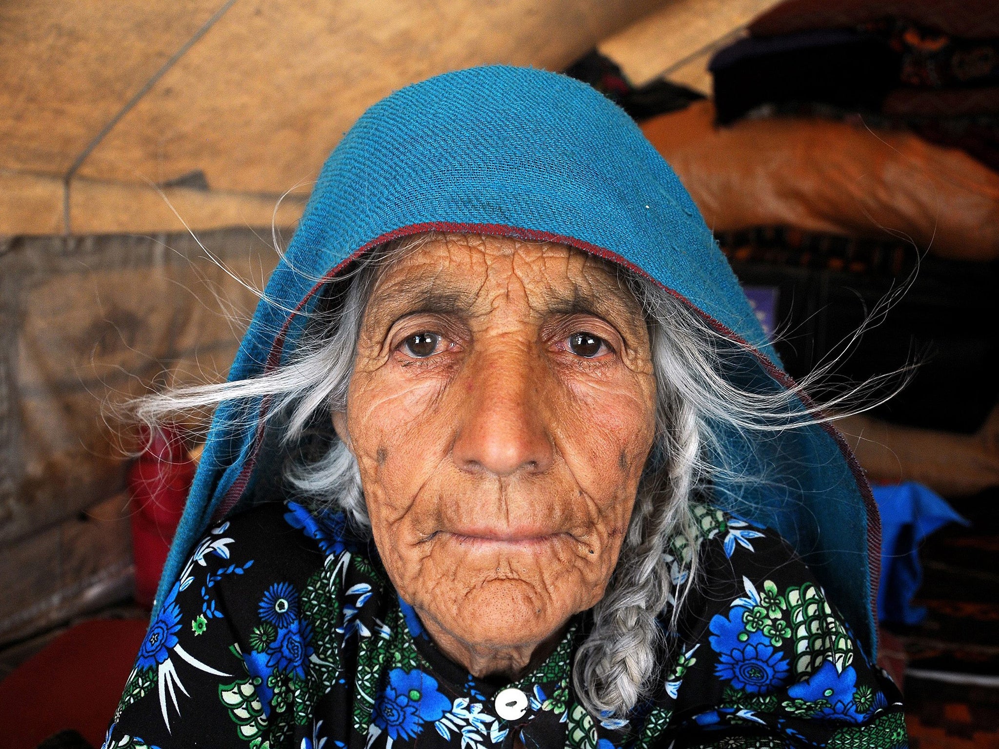 An Afghan displaced from her home in the Sherin Tagab district of Faryab province