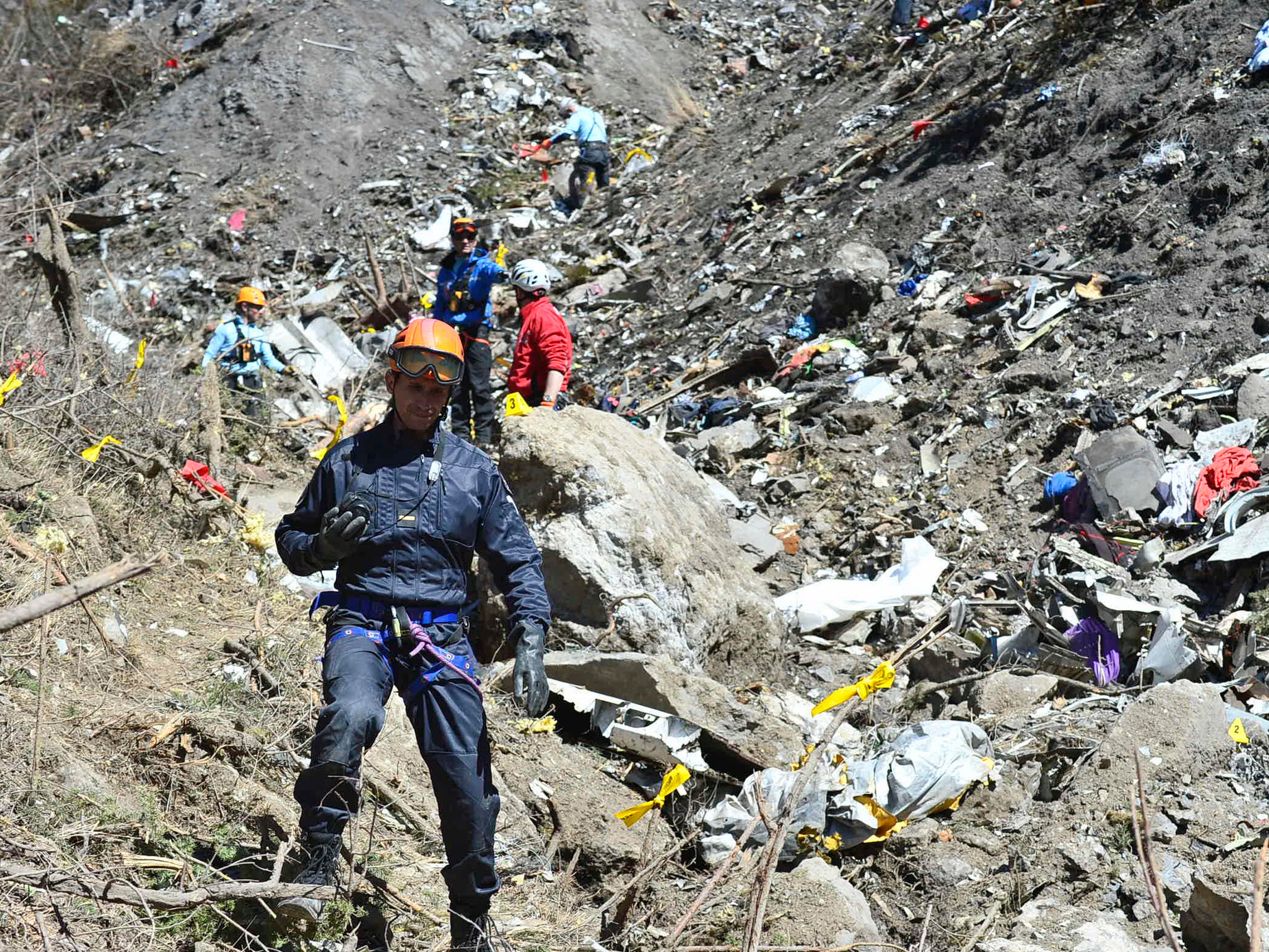 Rescue workers and gendarmerie continue their search operation near the site of the Germanwings plane crash in the French Alps