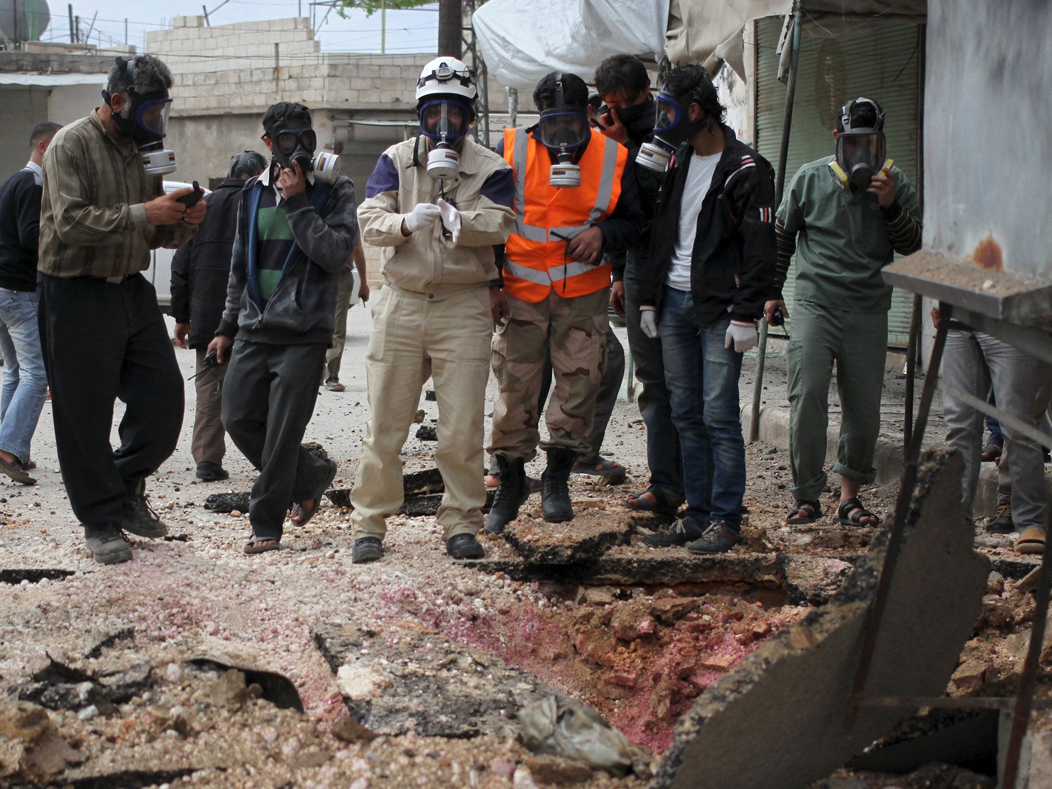 Syria's Civil Defence members after what activists claim was an earlier chemical attack on 3 May