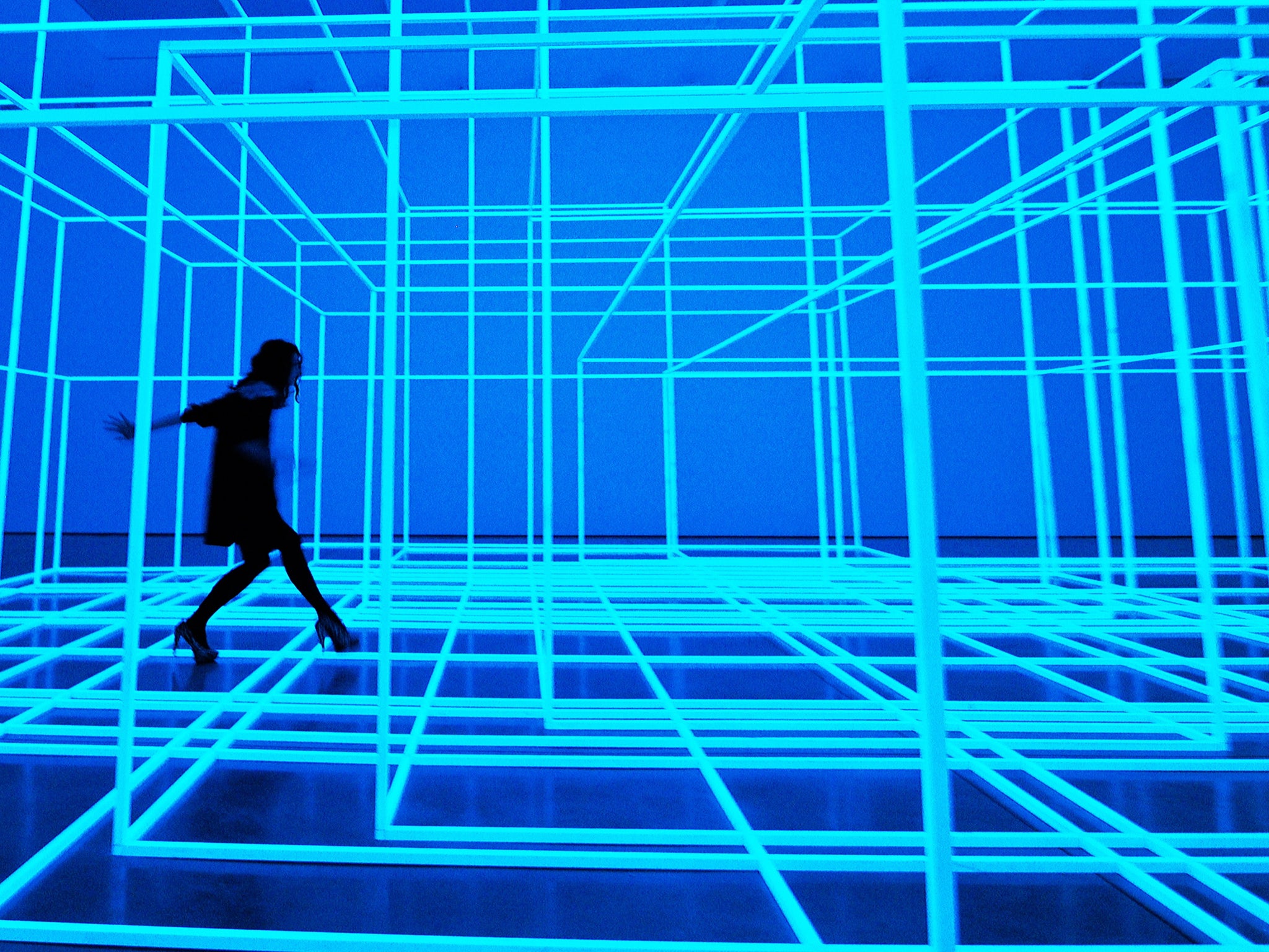 An employee walks through Antony Gormley's installation, Breathing Room III, at his exhibition 'Test Sites' at the White Cube Gallery, London