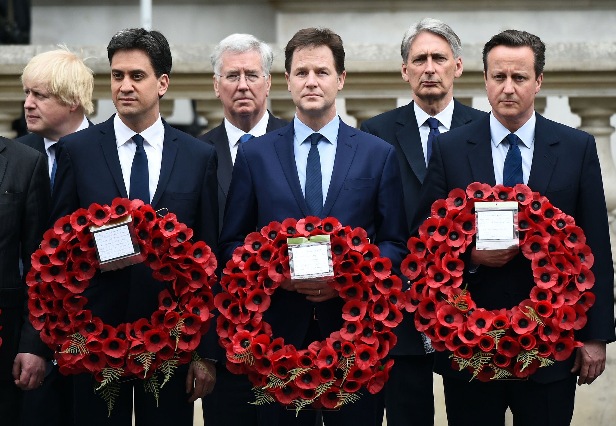 (L-R) outgoing opposition Labour Party leader Ed Miliband, British Prime Minister David Cameron and outgoing Liberal Democratic Party leader Nick Clegg attend a VE Day service of remembrance at the Cenotaph on Whitehall in London, to commemorate the 70th