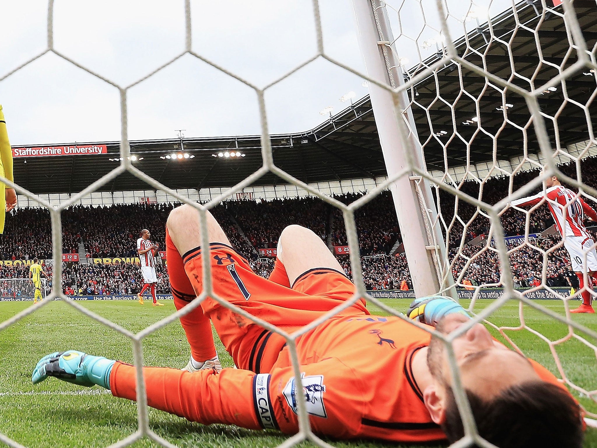 Hugo Lloris lies on the floor in despair after conceding a goal