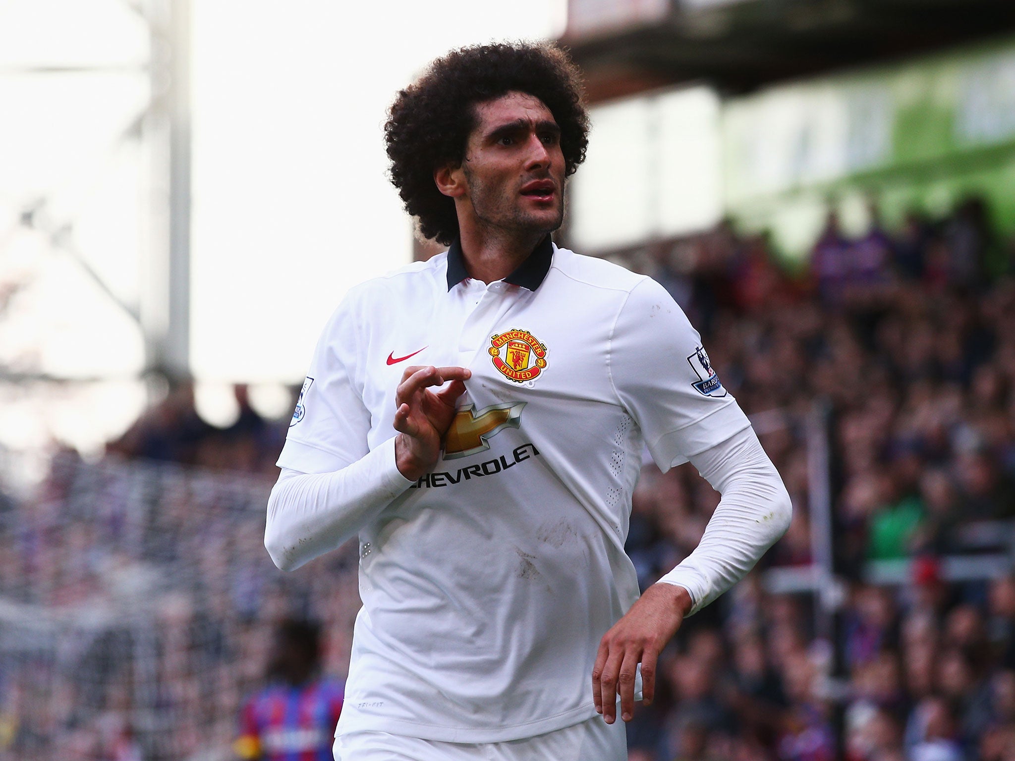 Maruoane Fellaini celebrates after scoring against Crystal Palace