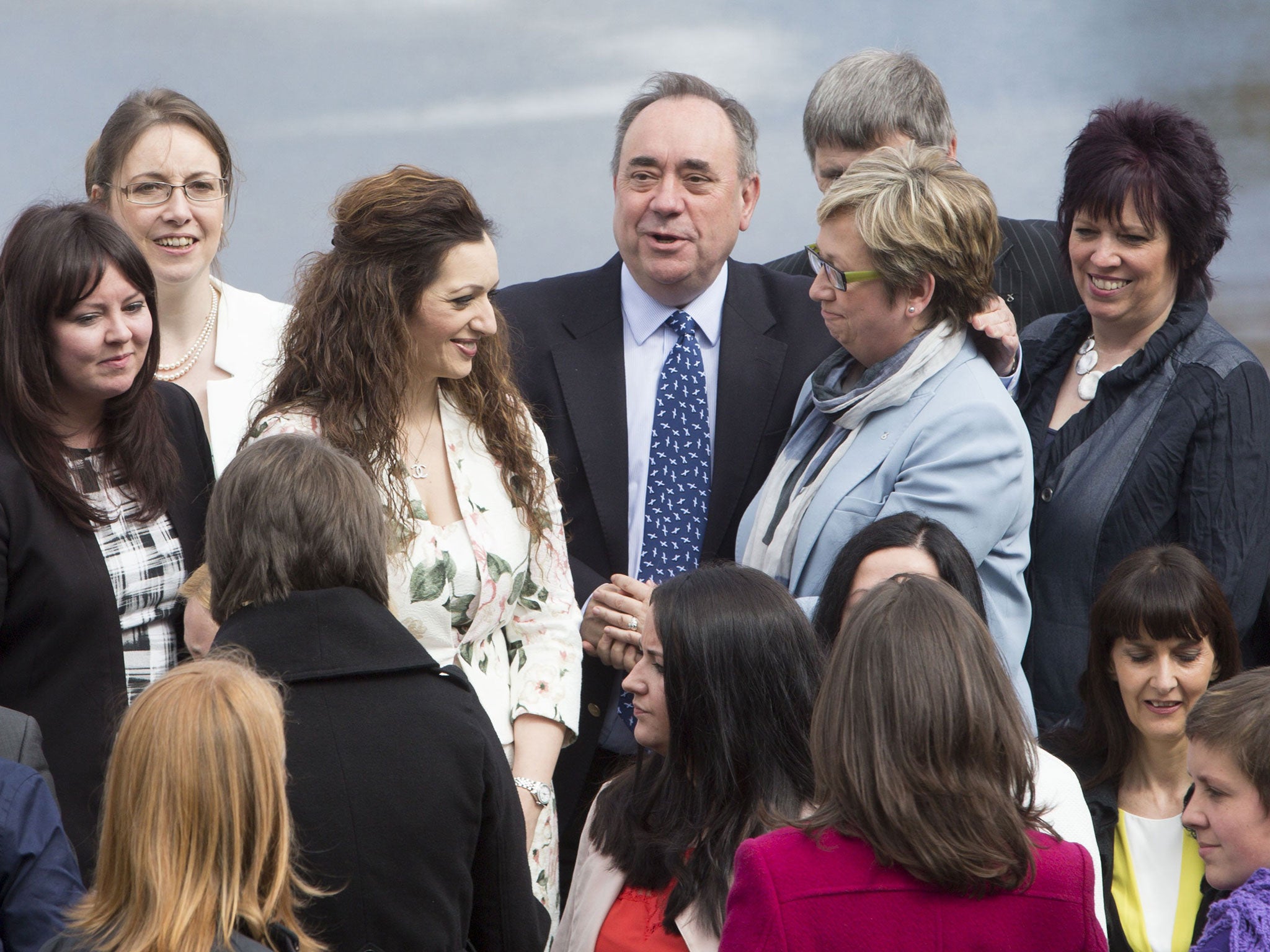 Former first minister of Scotland Alex Salmond (centre) joins fellow newly-elected SNP MPs in front of the Forth Rail Bridge in South Queensferry as the party marks its historic landslide general election victory in Scotland