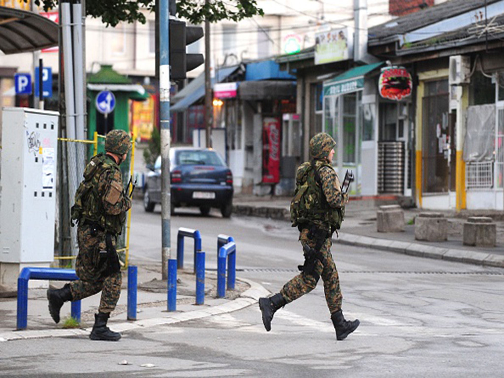 Police officers patrol in the streets of Kumanovo after armed incidents near the Kosovo border left four policemen injured