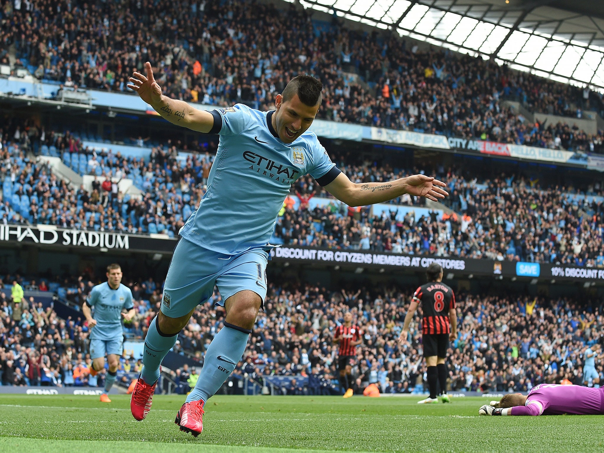 Sergio Aguero celebrates one of his goals against QPR