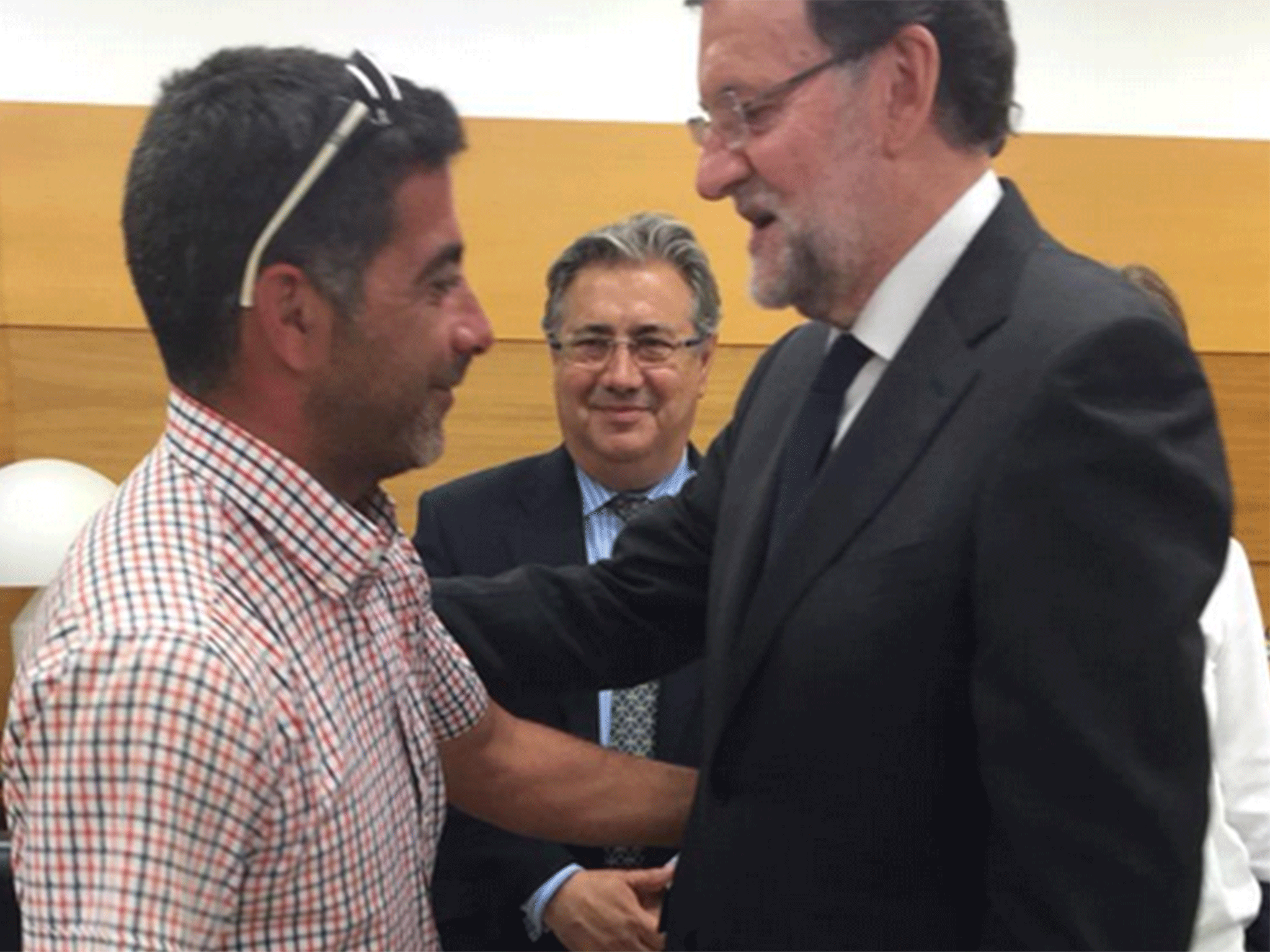 Spanish president Mariano Rajoy meets a farmer who helped pull Airbus crew away from burning wreckage