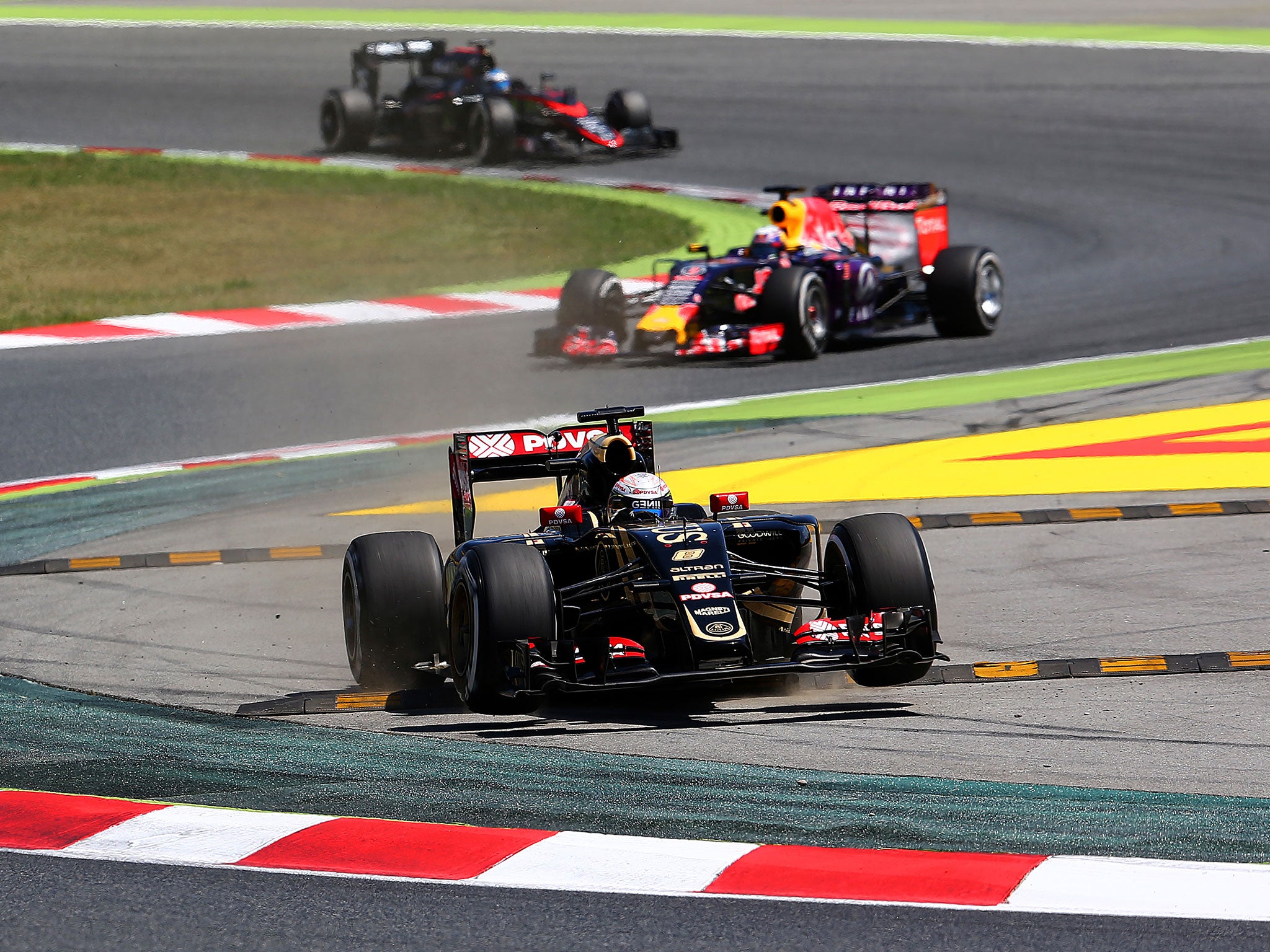 Grosjean goes off at turn two after running deep into turn one