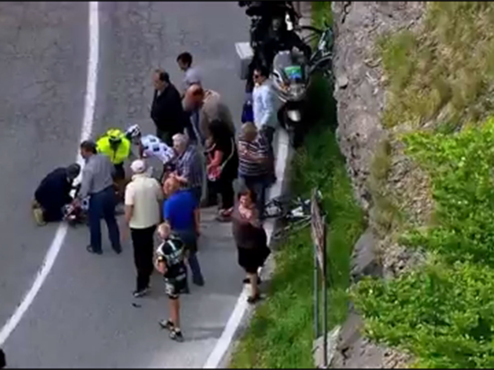 Paramedics treat Pozzovivo following the nasty crash on the Giro's third stage