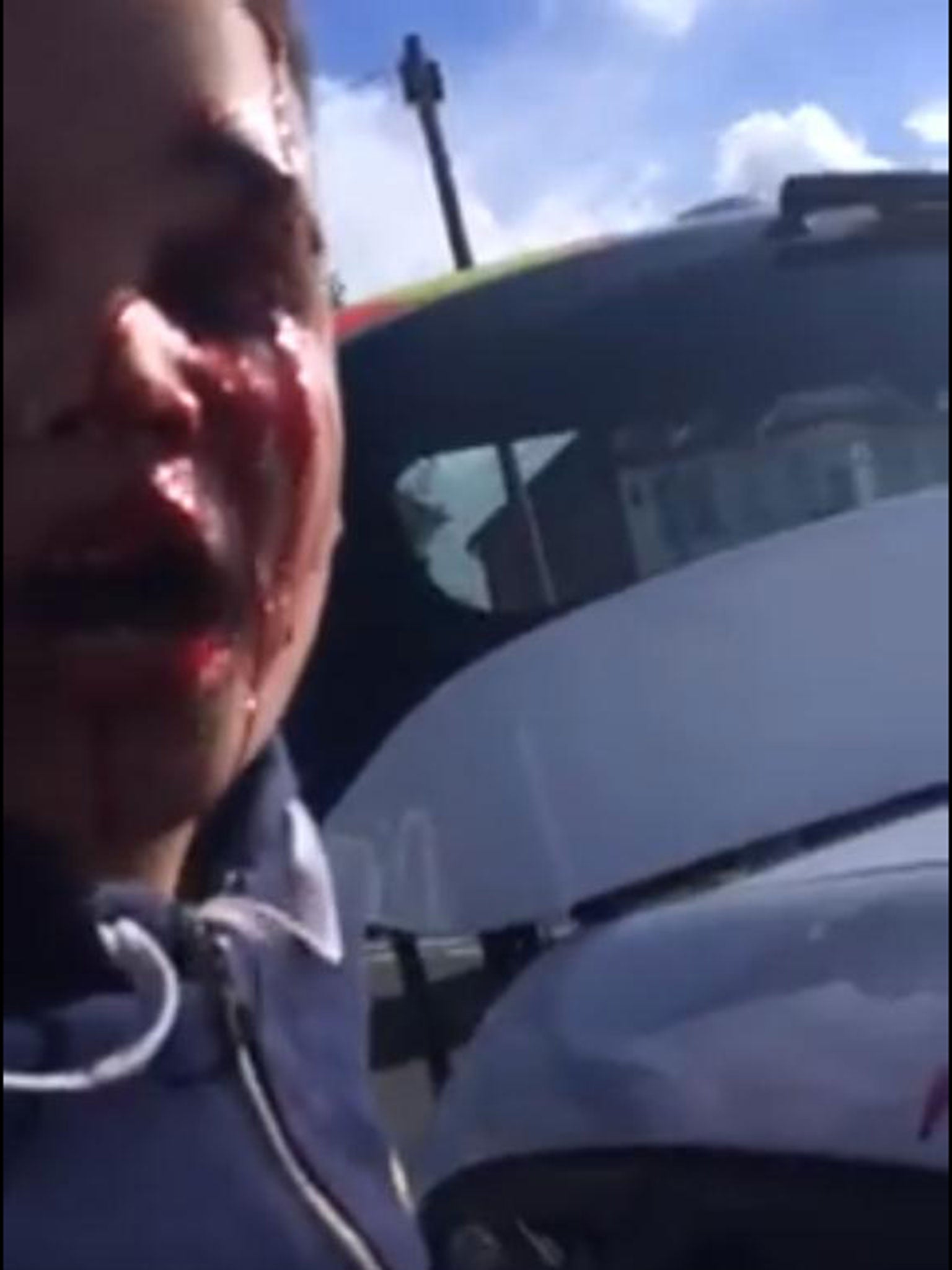 Declan is filmed being held at the police car