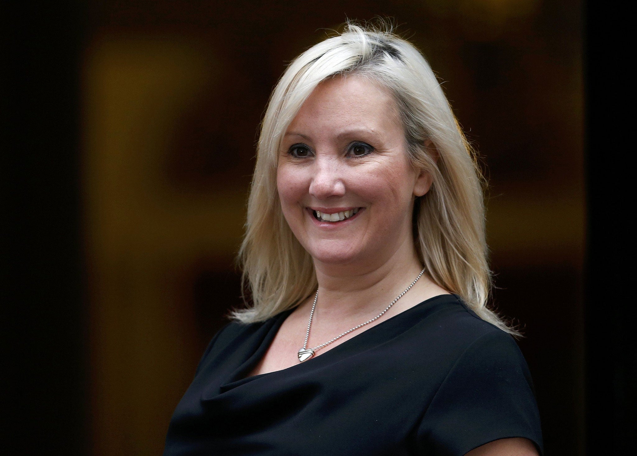 Caroline Dinenage arrives for Britain's Prime Minister David Cameron's first cabinet meeting at 10 Downing Street