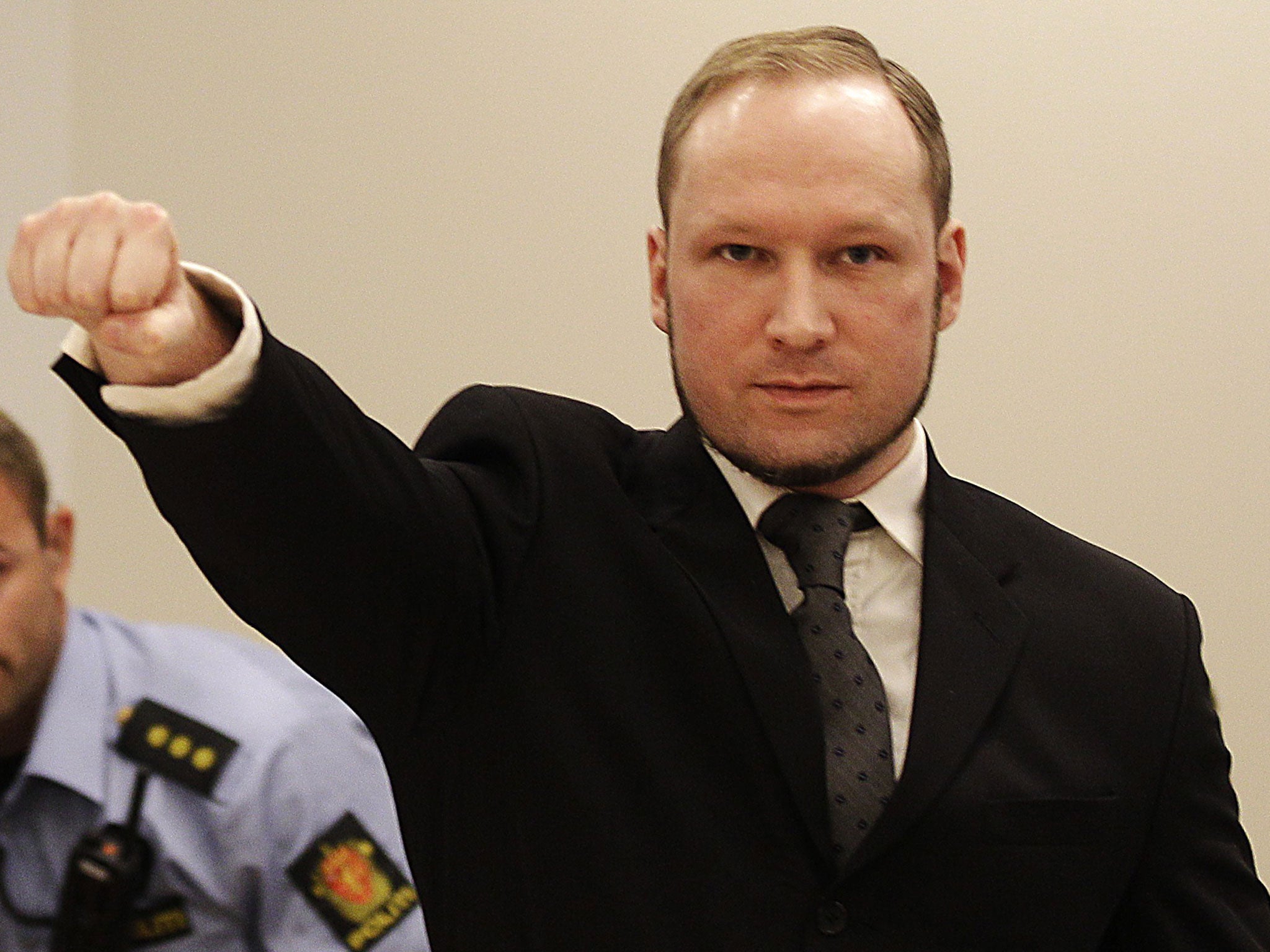 Anders Behring Breivik gives a Nazi salute in a Norwegian courtroom during his trial