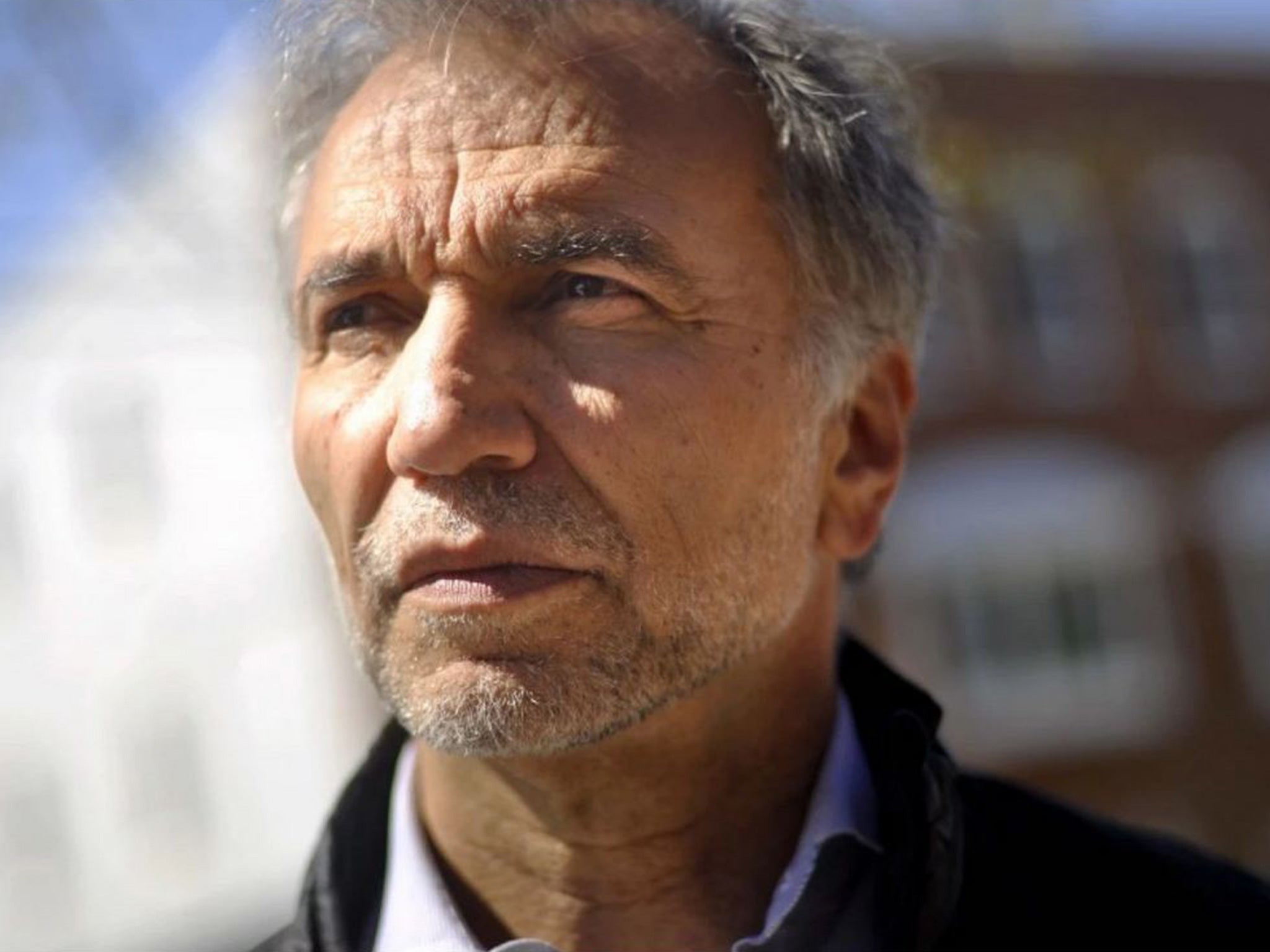 Sam Tsemberis, founder and CEO of Pathways to Housing, stands near one of the buildings in NE Washington D.C. that offers housing to formerly homeless