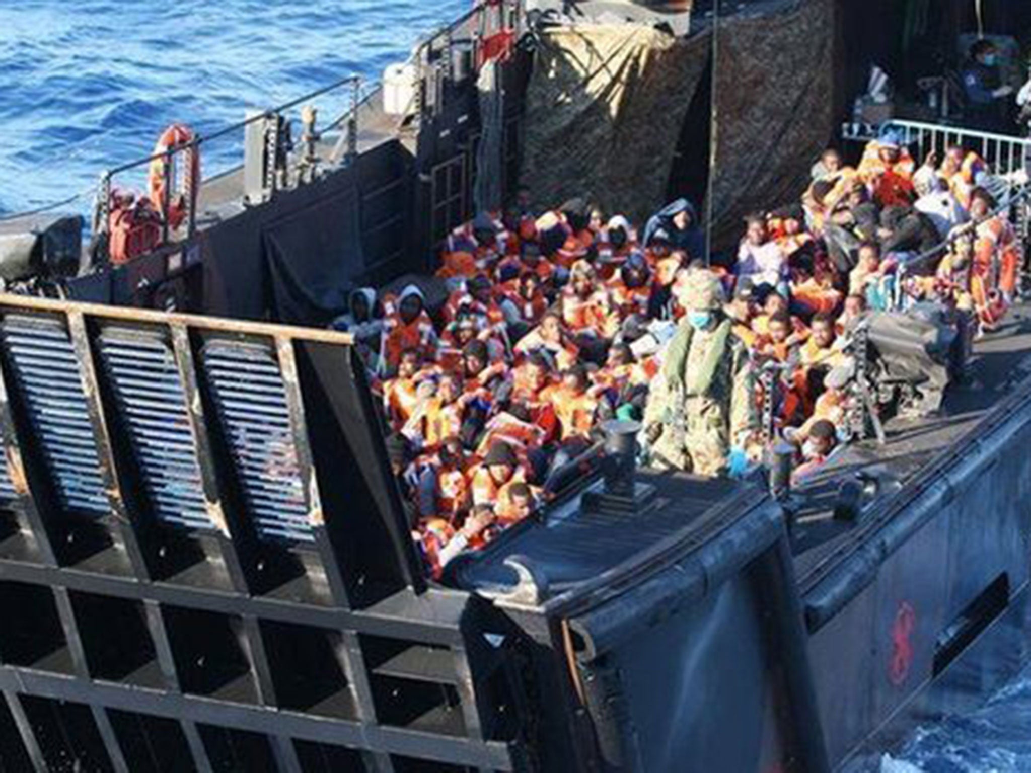 An estimated 445 migrants were rescued after their rubber dinghies got in trouble 45 miles from Libya (MoD)