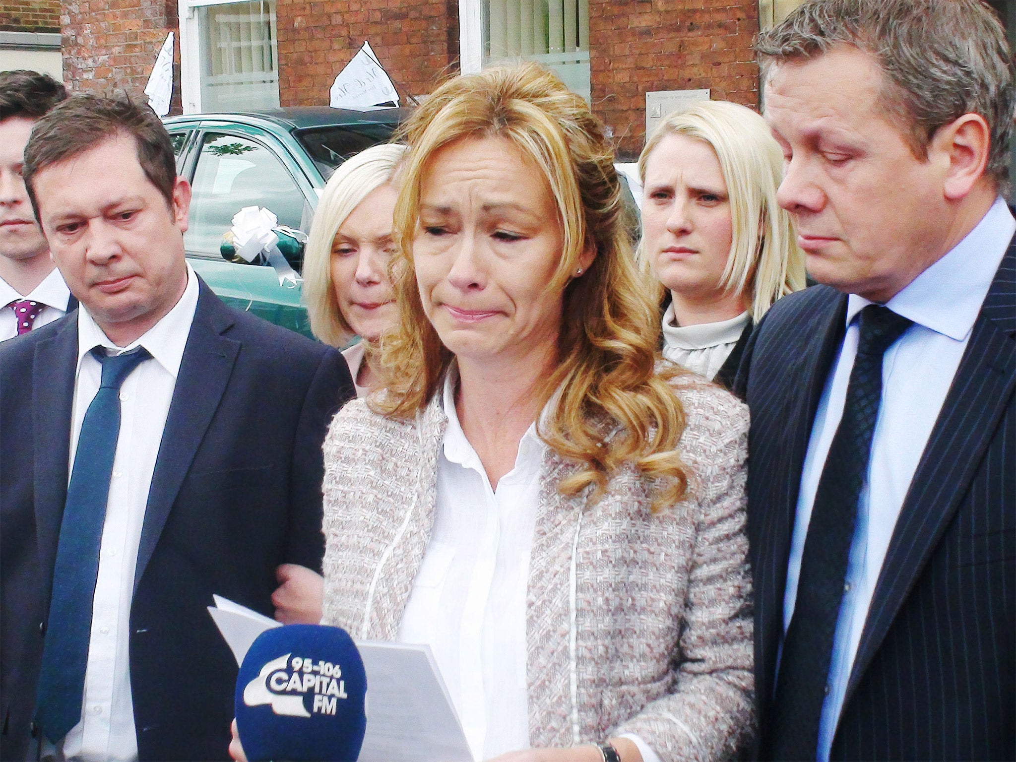 Sharon Wood, with her children’s father, Neil Shepherd, left, and her husband, Paul, right, outside Wakefield Coroner’s Court on Wednesday