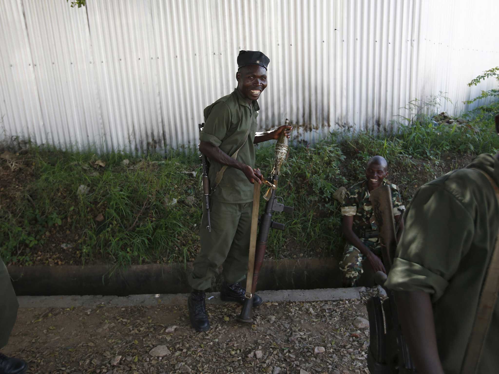 A soldier loyal to President Nkurunziza smiles in the capital