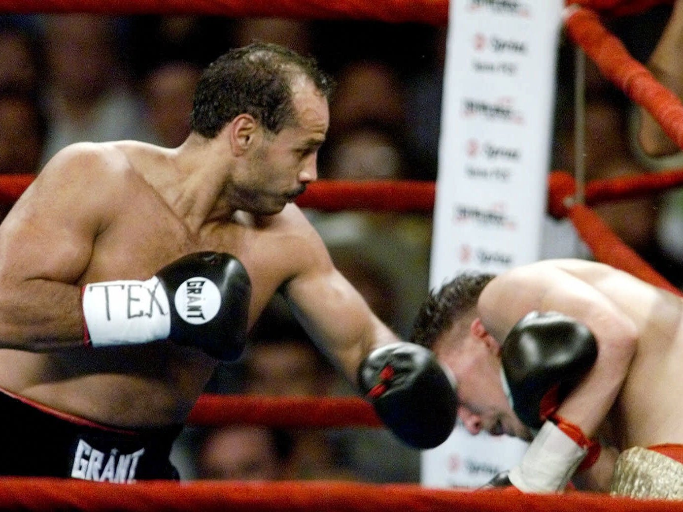 Tony Ayala, Jr., left, knocks down Manuel Esparza during the third round in his comeback match after 16 years in prison