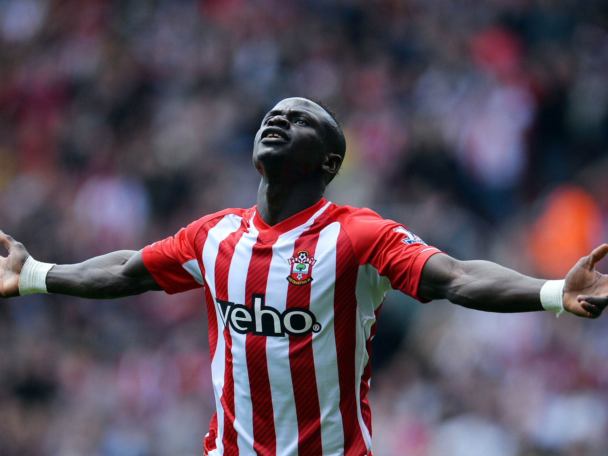 Sadio Mane celebrates netting the fastest hat-trick in Premier League history