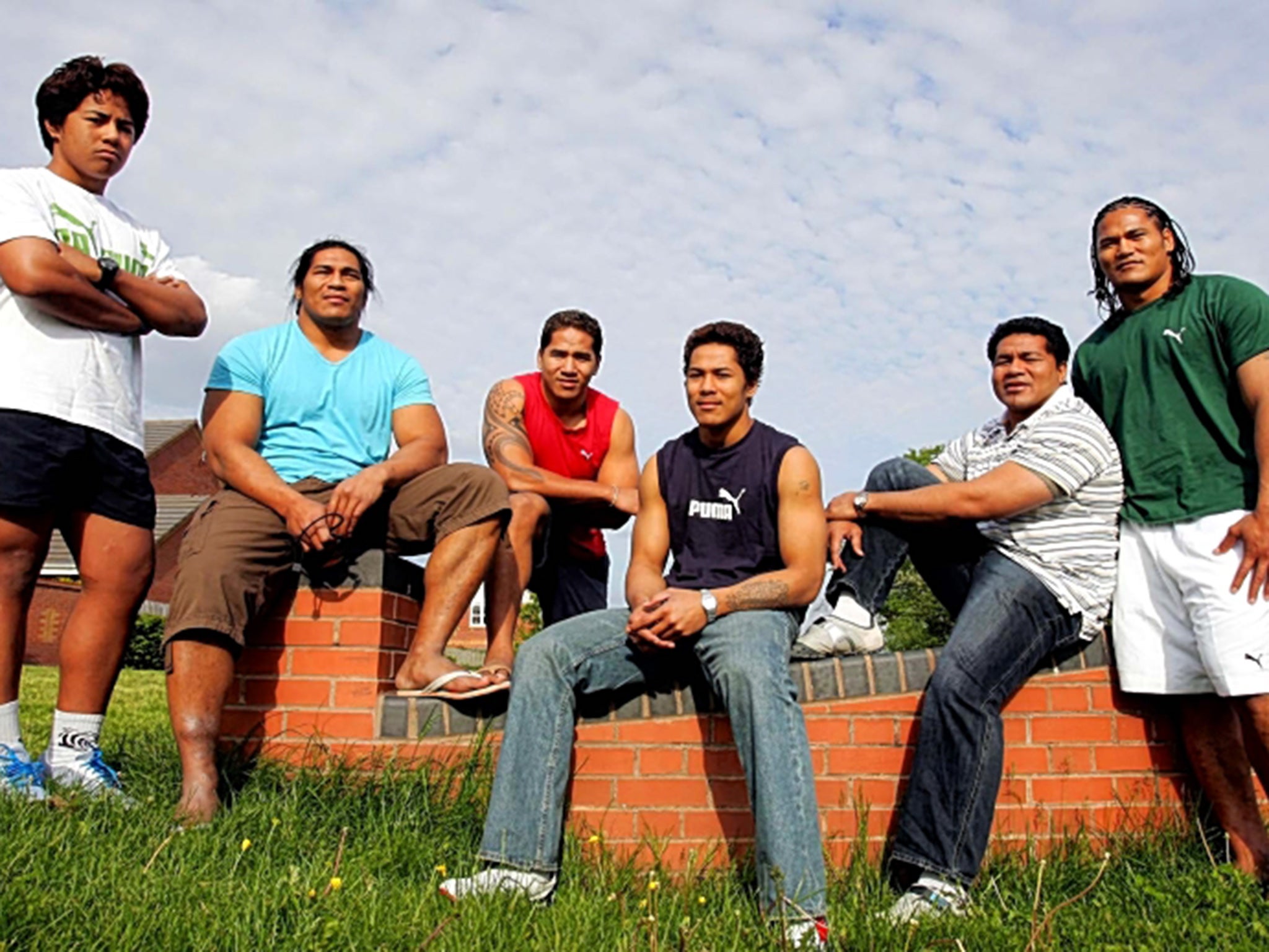 Robert Hallam’s 2006 portrait of the Tuilagi brothers includes the 15-year-old Manu (far left)