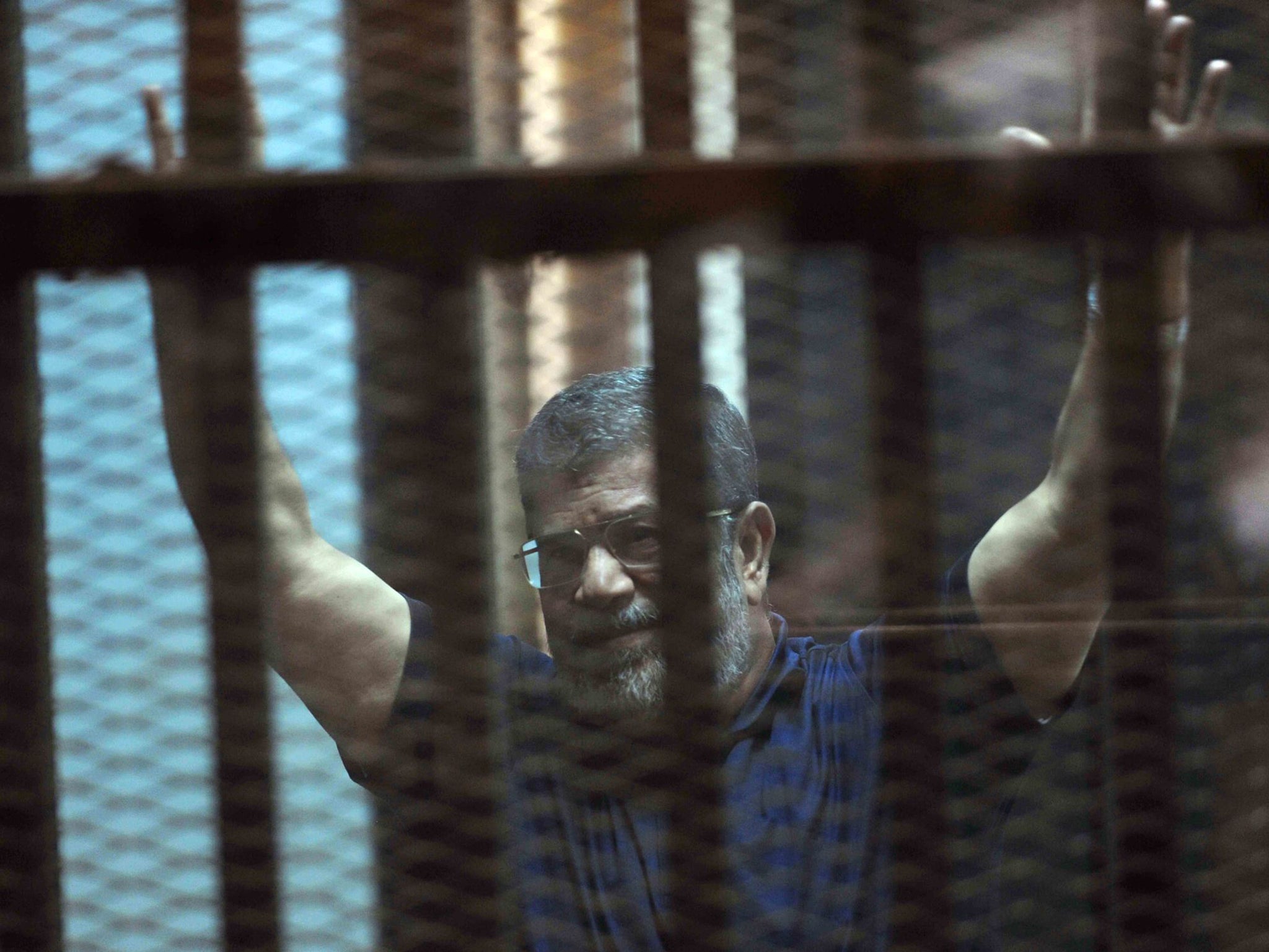 Mohamed Morsi as he is sentenced to death in a Cairo courtroom