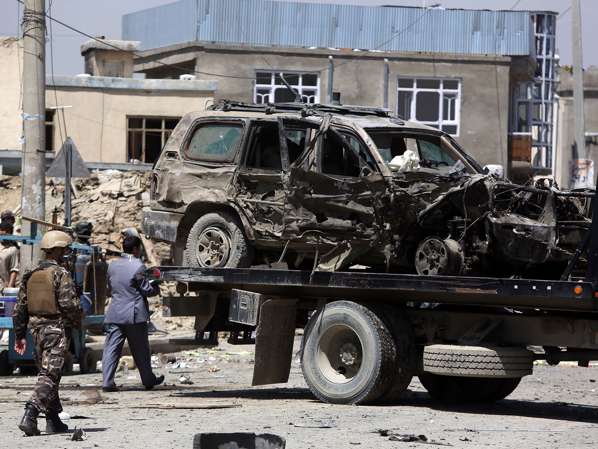 A EU vehicle is removed from the scene which left three people dead