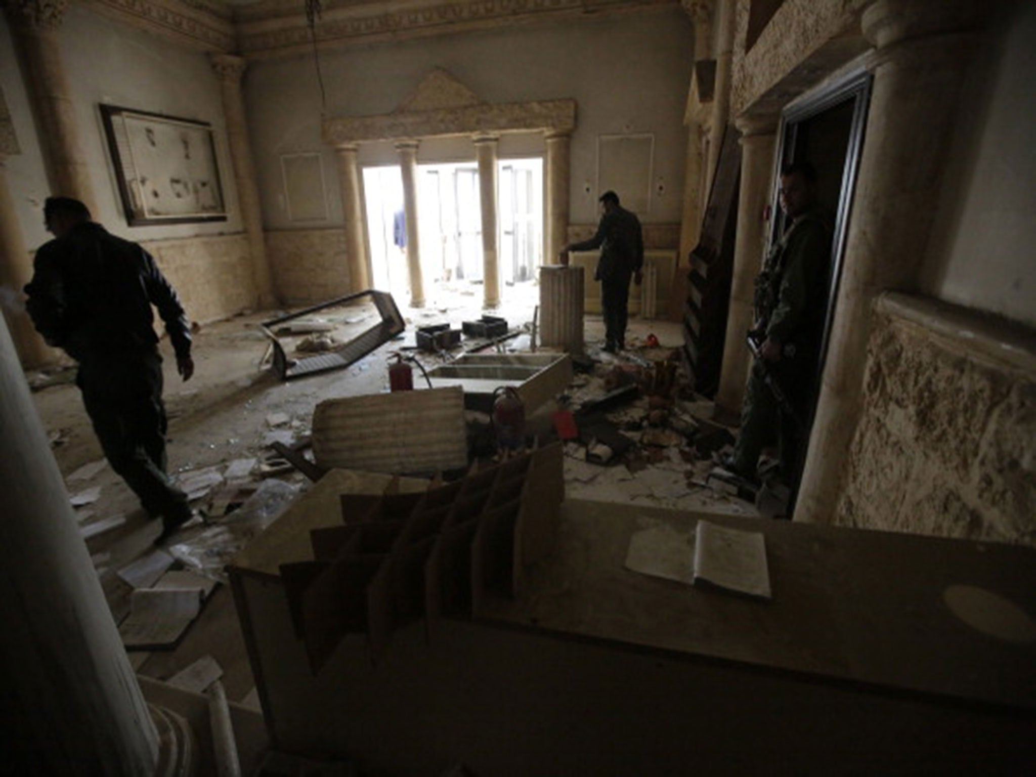 The ransacked Sham Zenobia Palace Hotel opposite the ruins of the ancient city of Palmyra